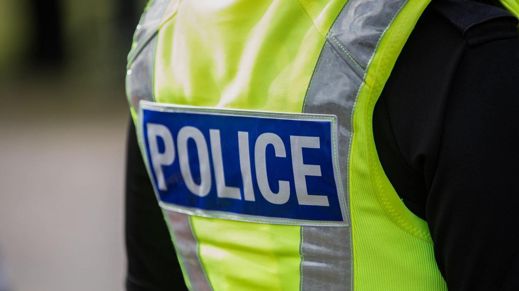 A stock image of a police officer's high-visibility vest