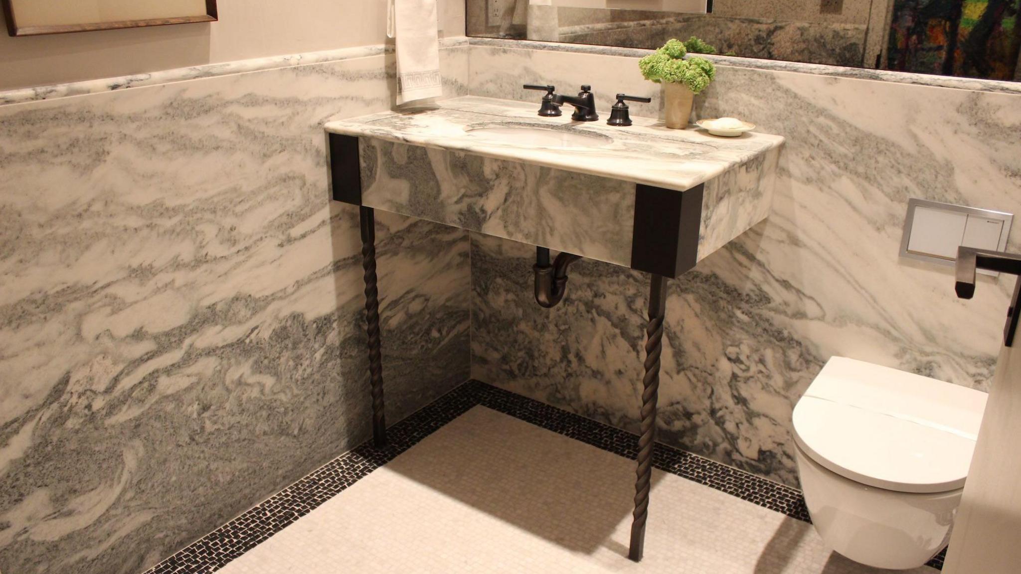 Image of marble bathroom with bathroom sink vanity and steel support legs holding it up
