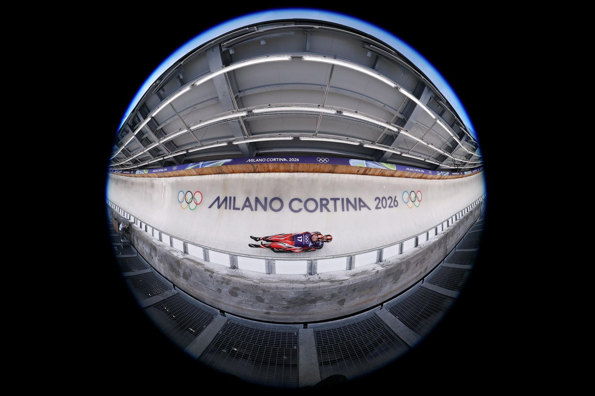 Austria's Riccardo Martin Schoepf and Juri Thomas Gatt practise on the luge track in Cortina d'Ampezzo