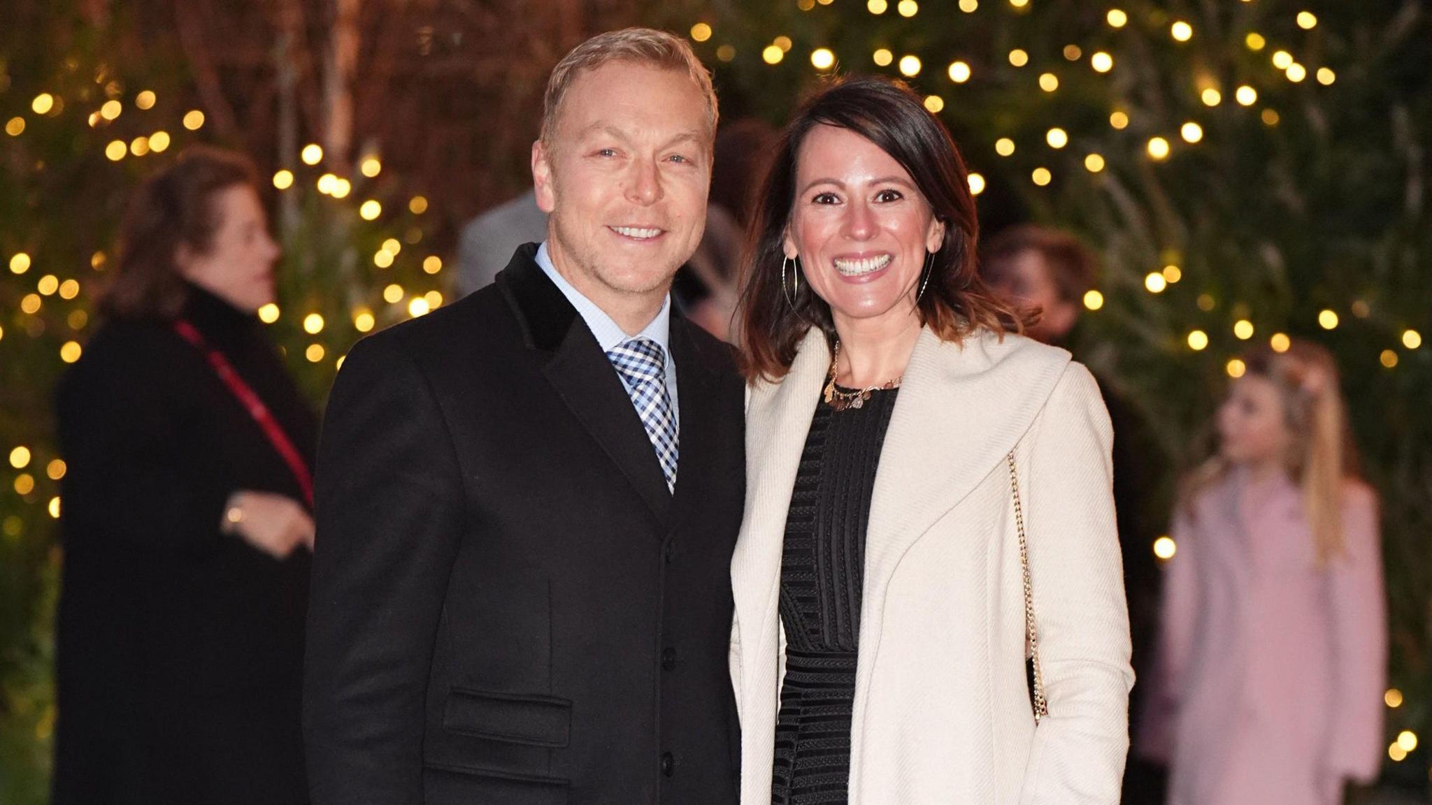 Sir Chris Hoy and his wife Sarra smile as they arrive for the annual service