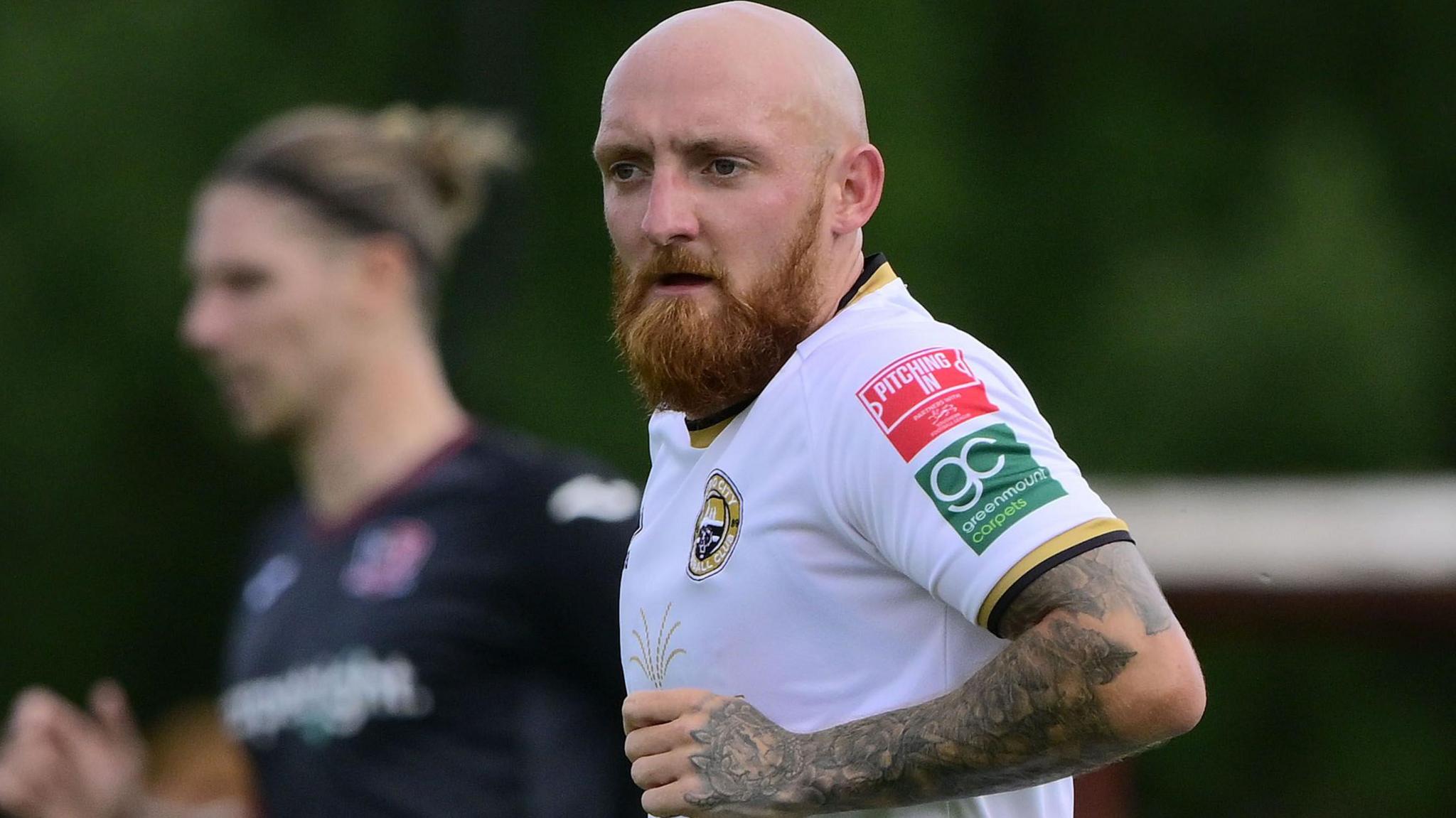 Dan Sullivan running on the field during a match