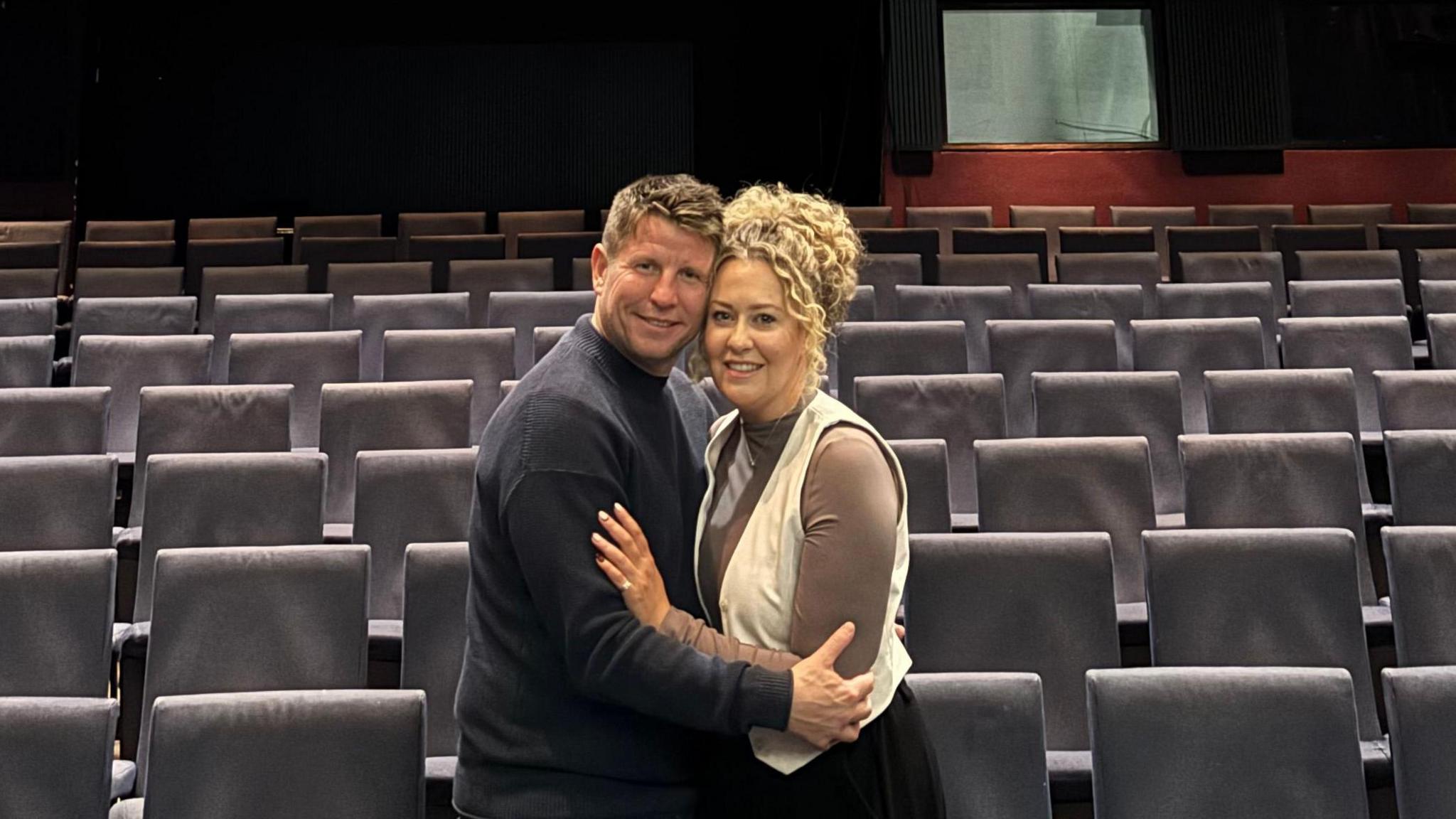 Graham and Hayley stood in the theatre