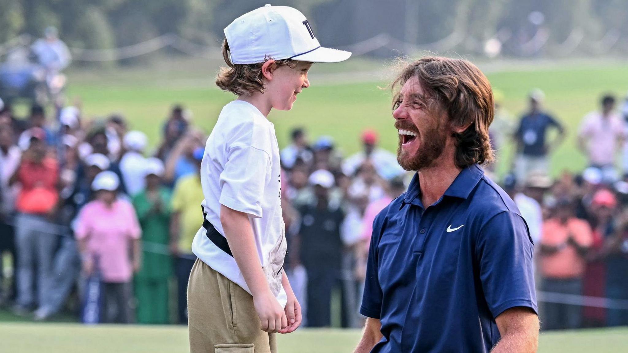 Tommy Fleetwood's son Frankie runs on to the 18th green to celebrate with him in Delhi