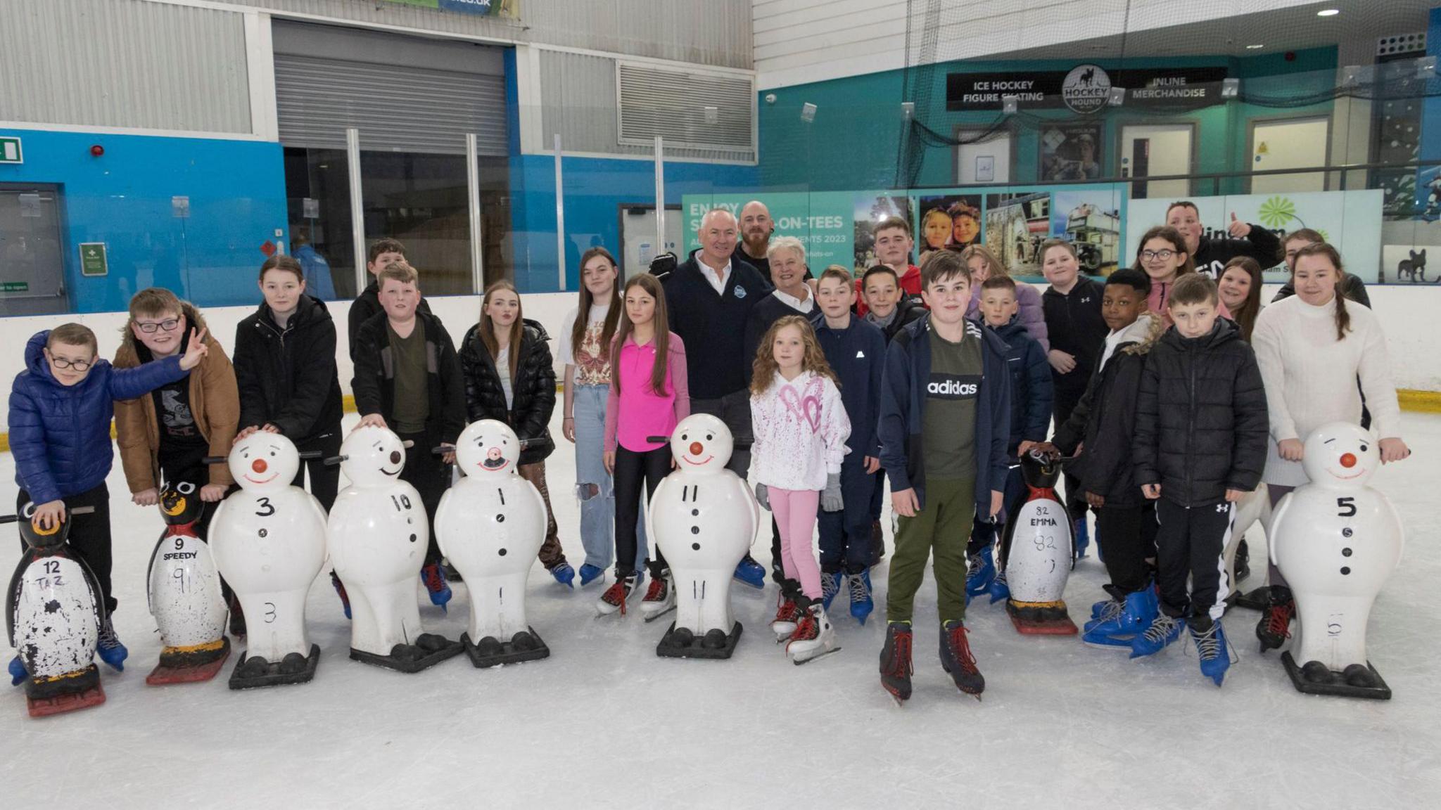 Mr Haswell and Mrs Keeley with pupils from Outwood Academy in Ormesby