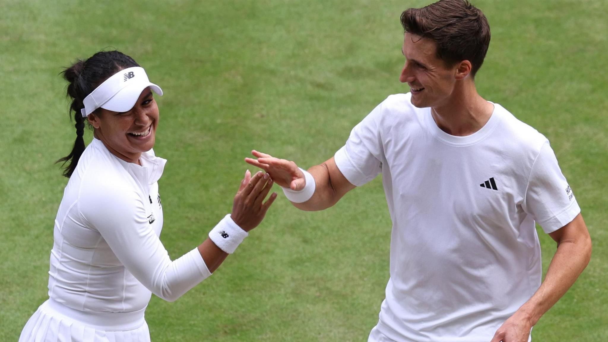 Heather Watson and Joe Salisbury celebrate winning a point