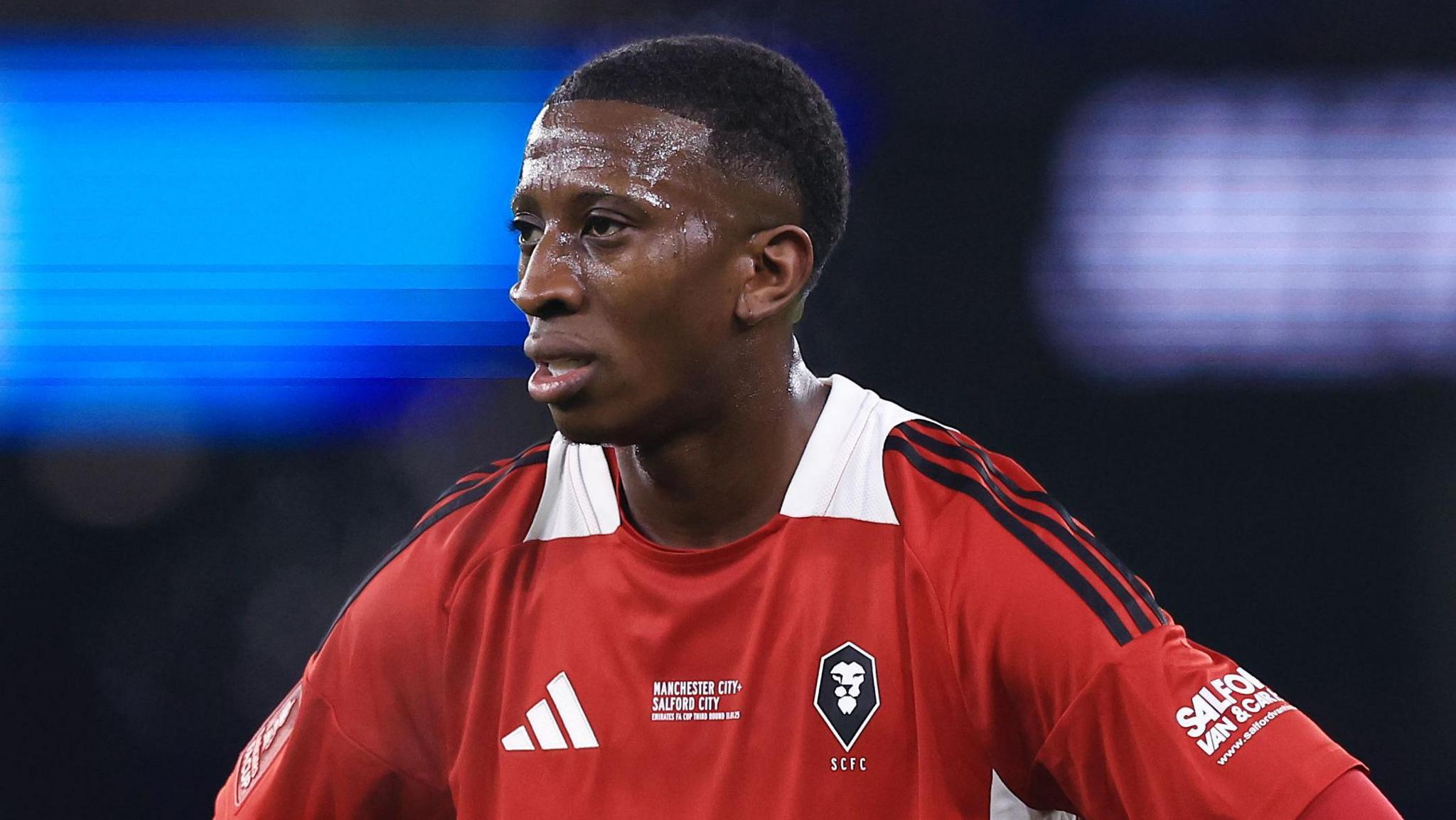 Tyrese Fornah playing for Salford against Manchester City