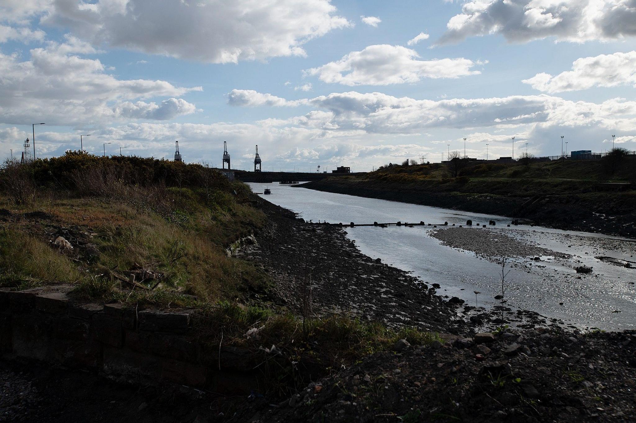 The River Afan with a view of industrial structures in the background