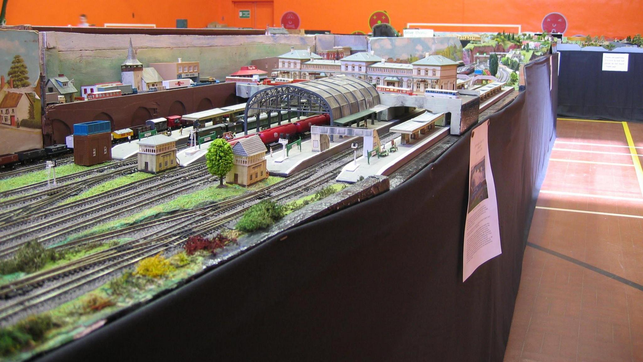 Jersey model train display with model buildings and railways in a gymnasium hall