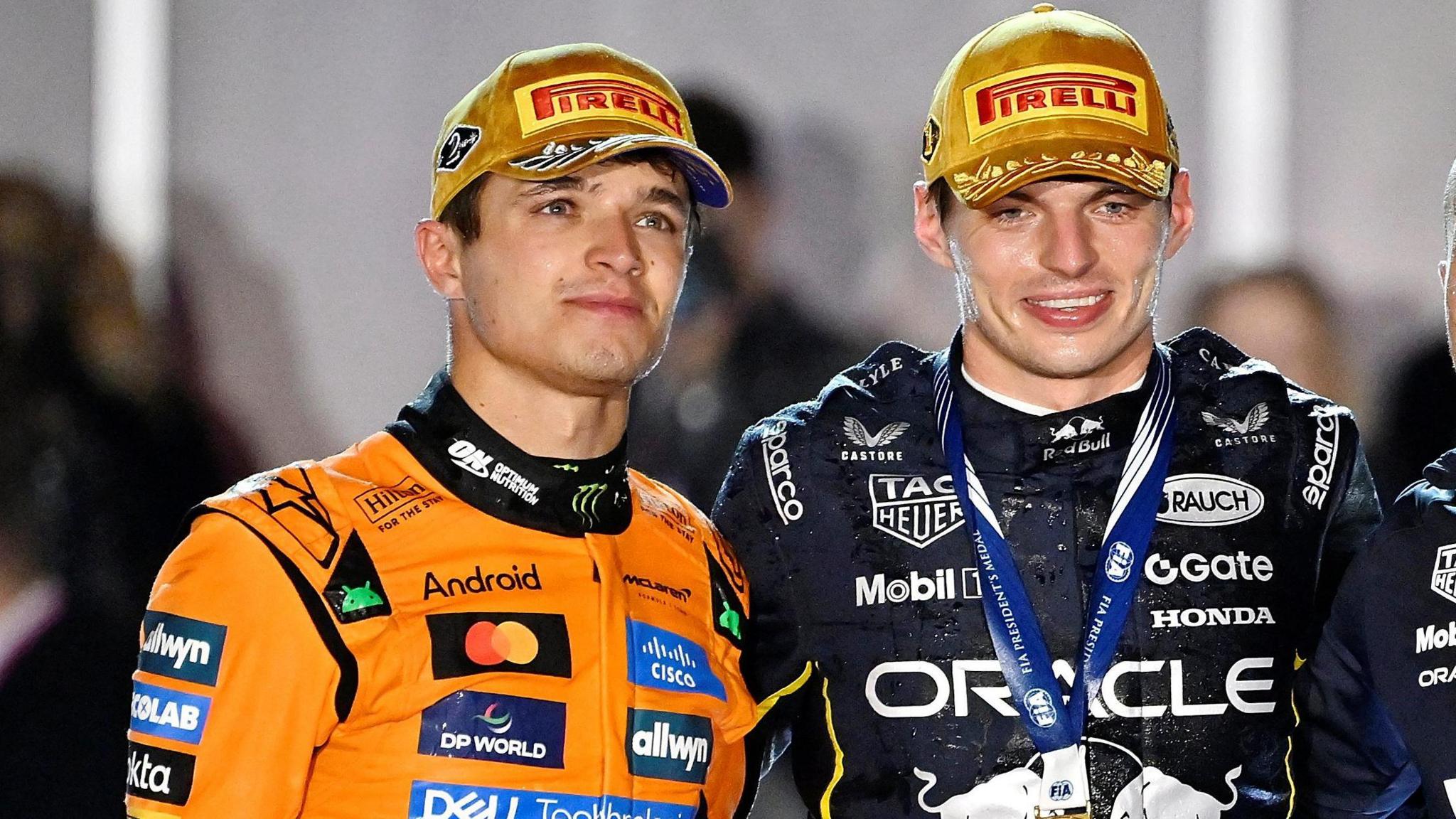 Lando Norris (left) stands alongside Max Verstappen (right) after the Las Vegas Grand Prix