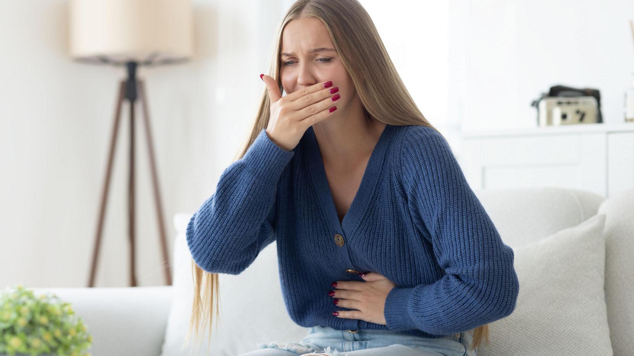 Young woman feeling sick 