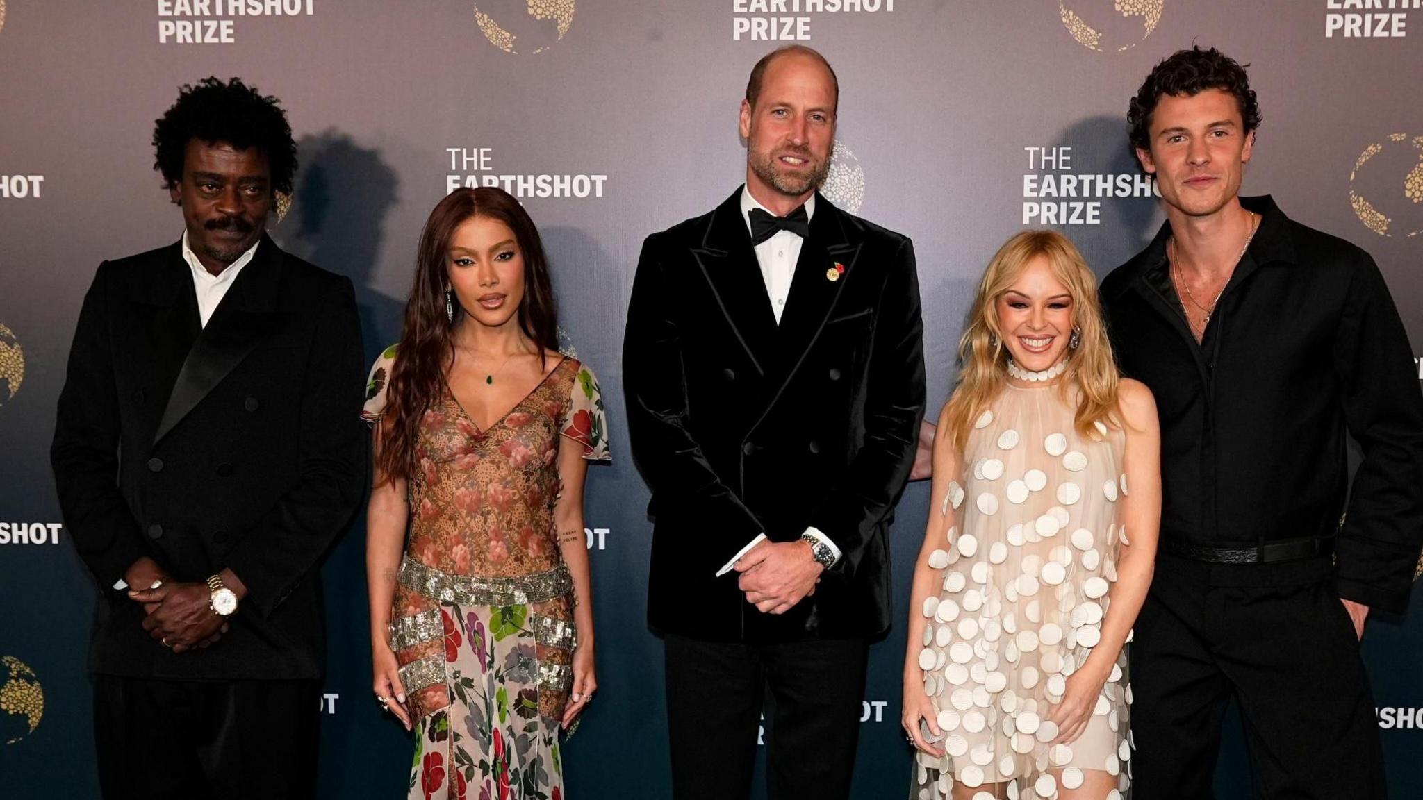 Seu Gorge, Anitta, the Prince of Wales, Kylie Minogue and Shawn Mendes pose for a photo in smart evening attire.