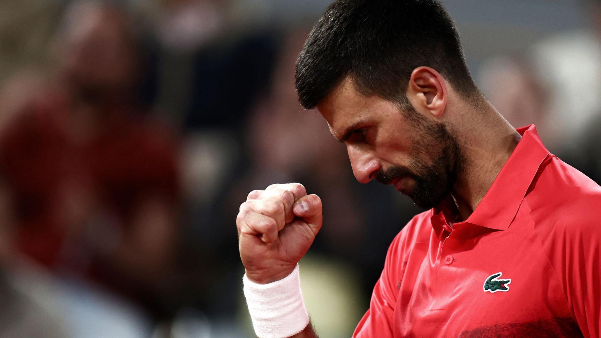 Novak Djokovic celebrates during his French Open match against Alexander Zverev