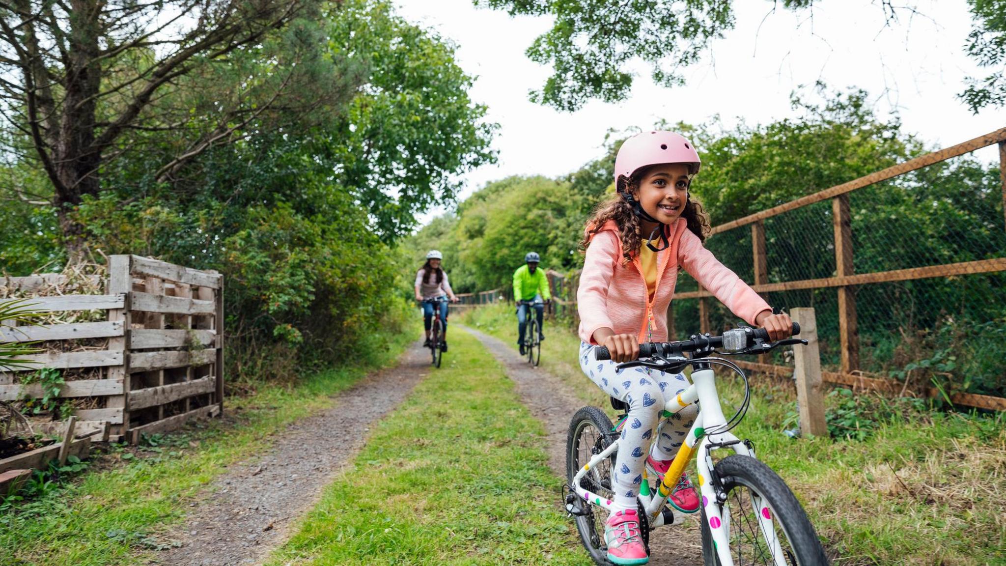 Girl cycling in park