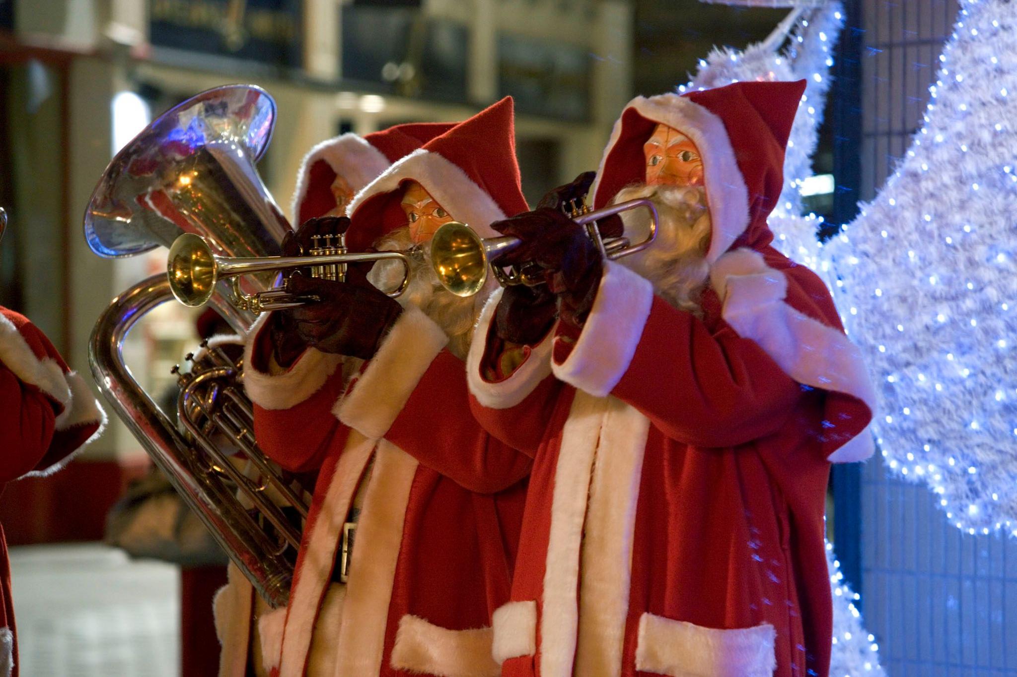 Robot Santas playing musical instruments