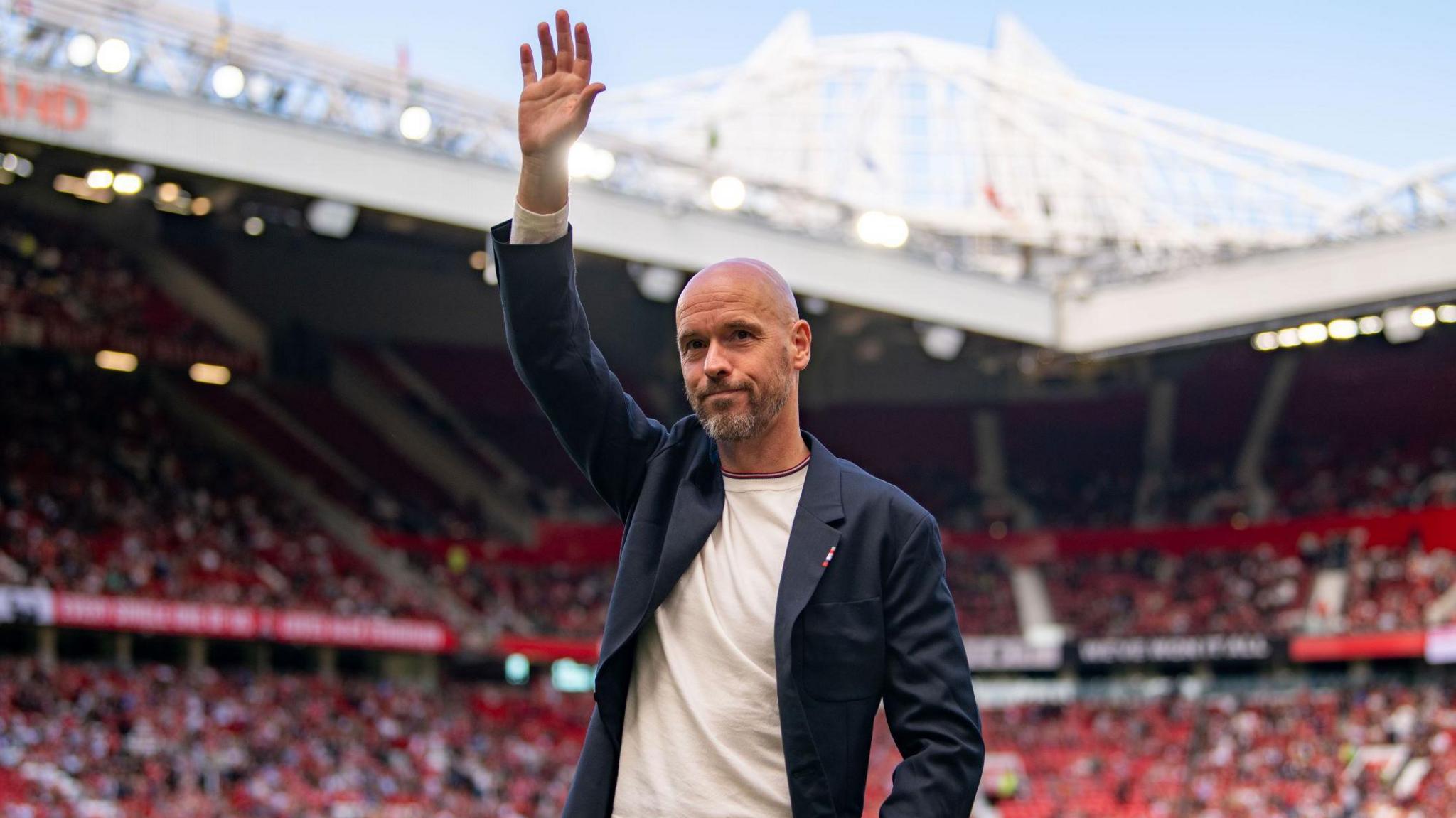 Erik ten Hag waves to the crowd