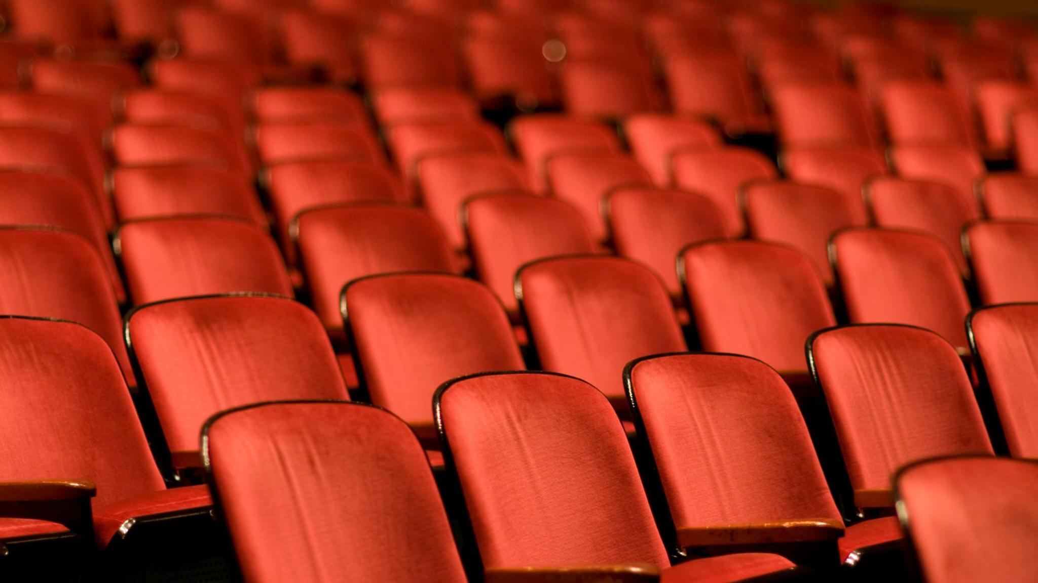 Rows of red theatre seats