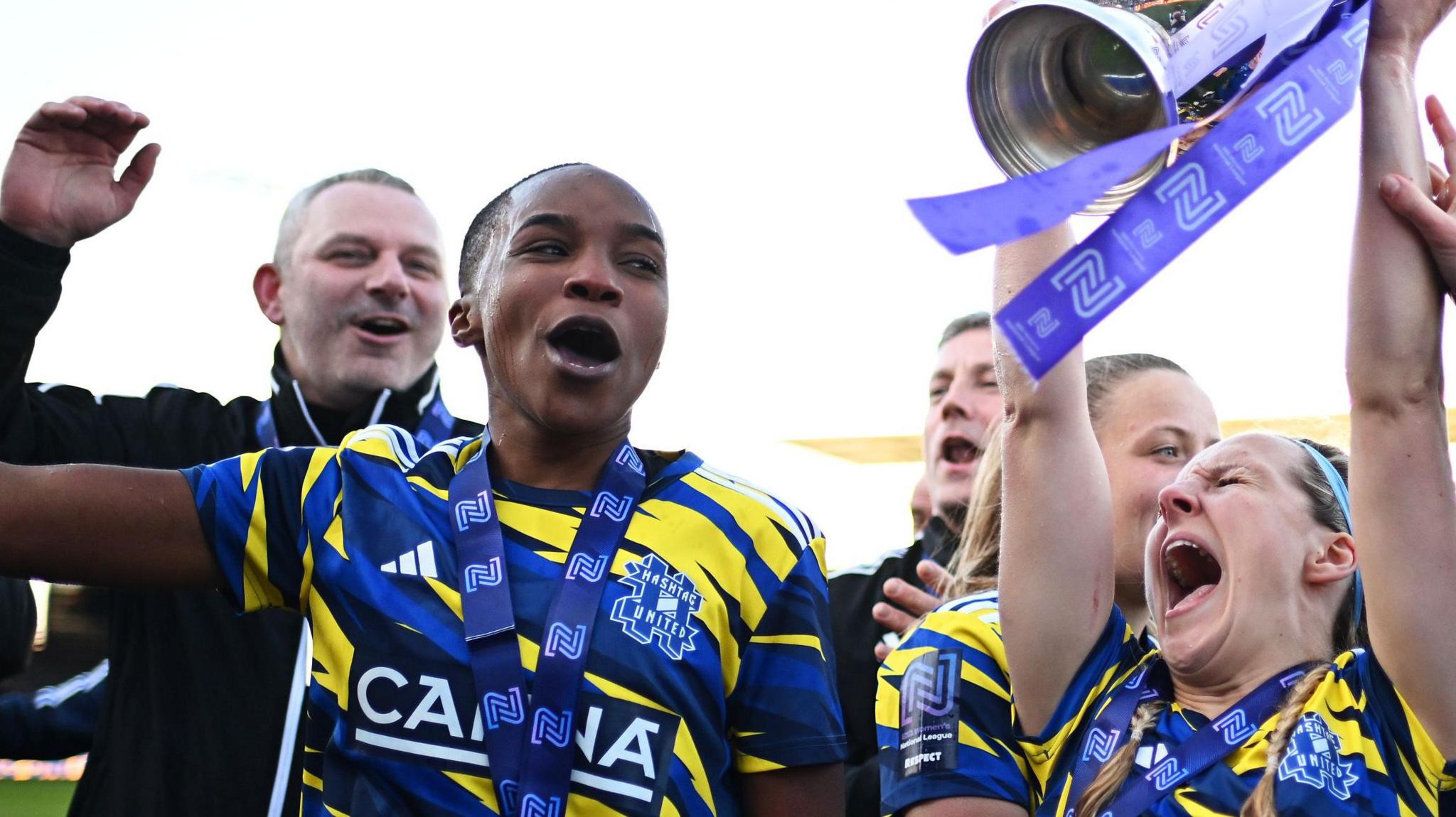 Sammy Rowlands and Hayley West of Hashtag United with the FA WNL Cup