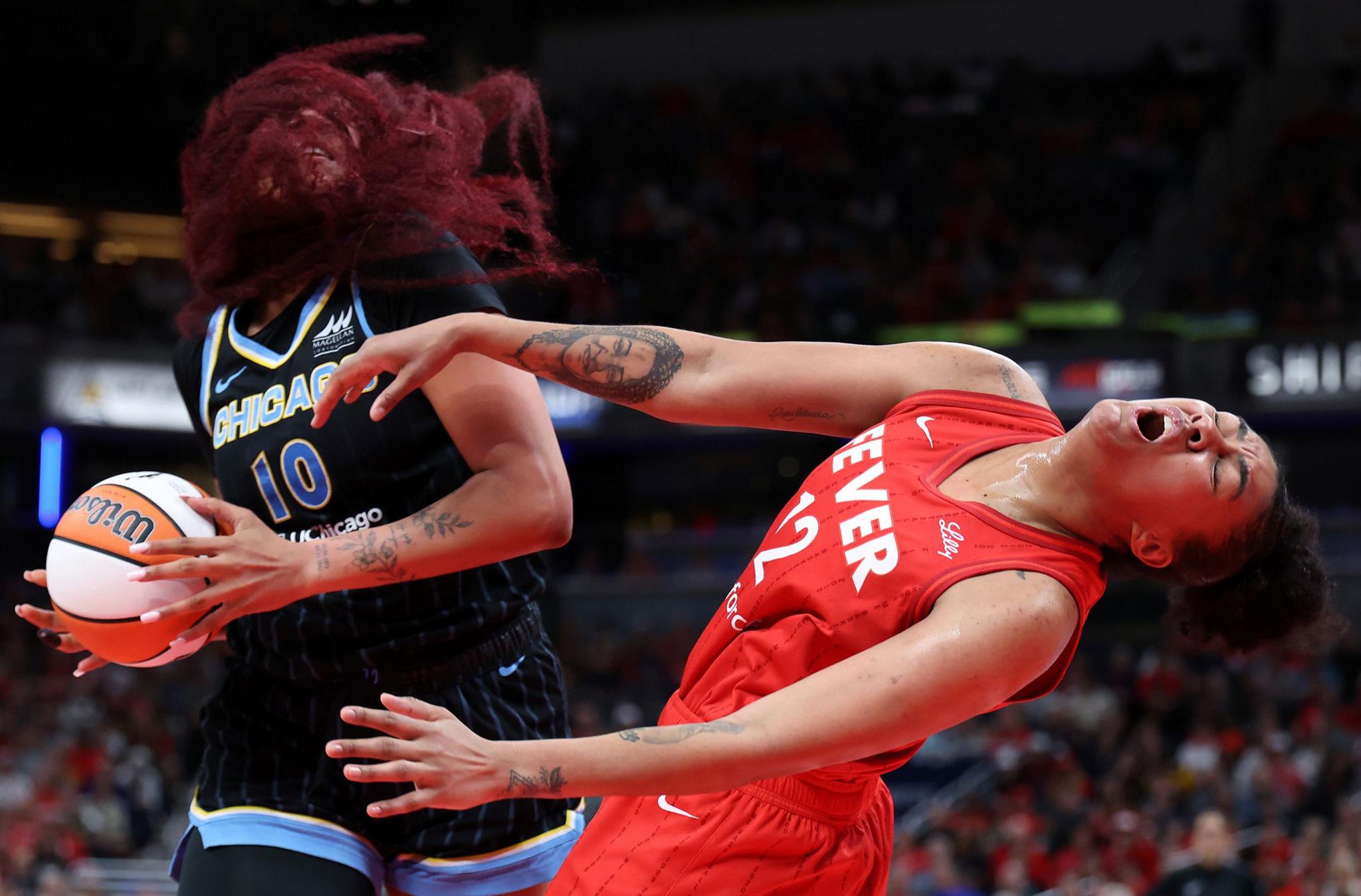 Chicago Sky's Kamilla Cardoso is fouled by Indiana Fever's Damiris Dantas during the third quarter at Gainbridge Fieldhouse in Indianapolis, Indiana. Photo by Justin Casterline