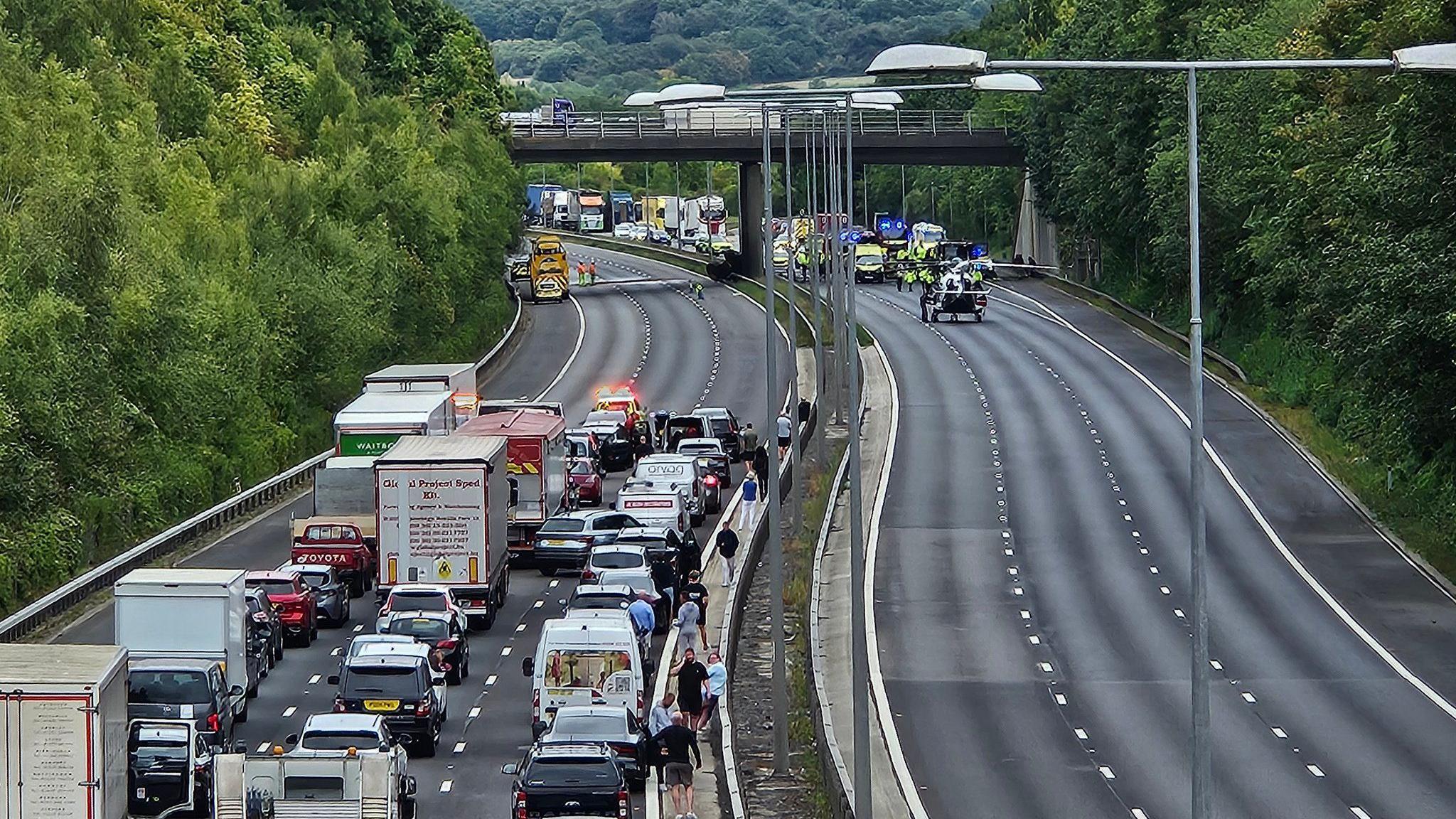 A build up of traffic on a section of motorway that has been closed in both directions.
