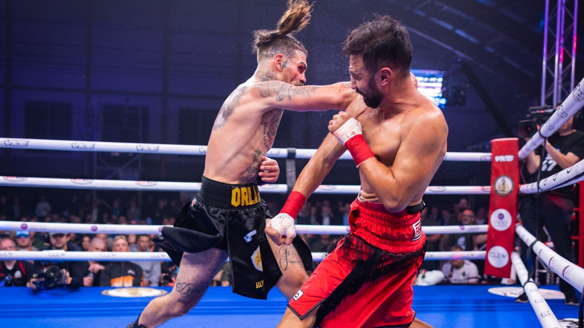 BKB bare-knuckle boxers, Tyler Goodjohn (left) and Paulie Malignaggi (right) aim punches at one another - Planet Ice, Leeds, October 2025.