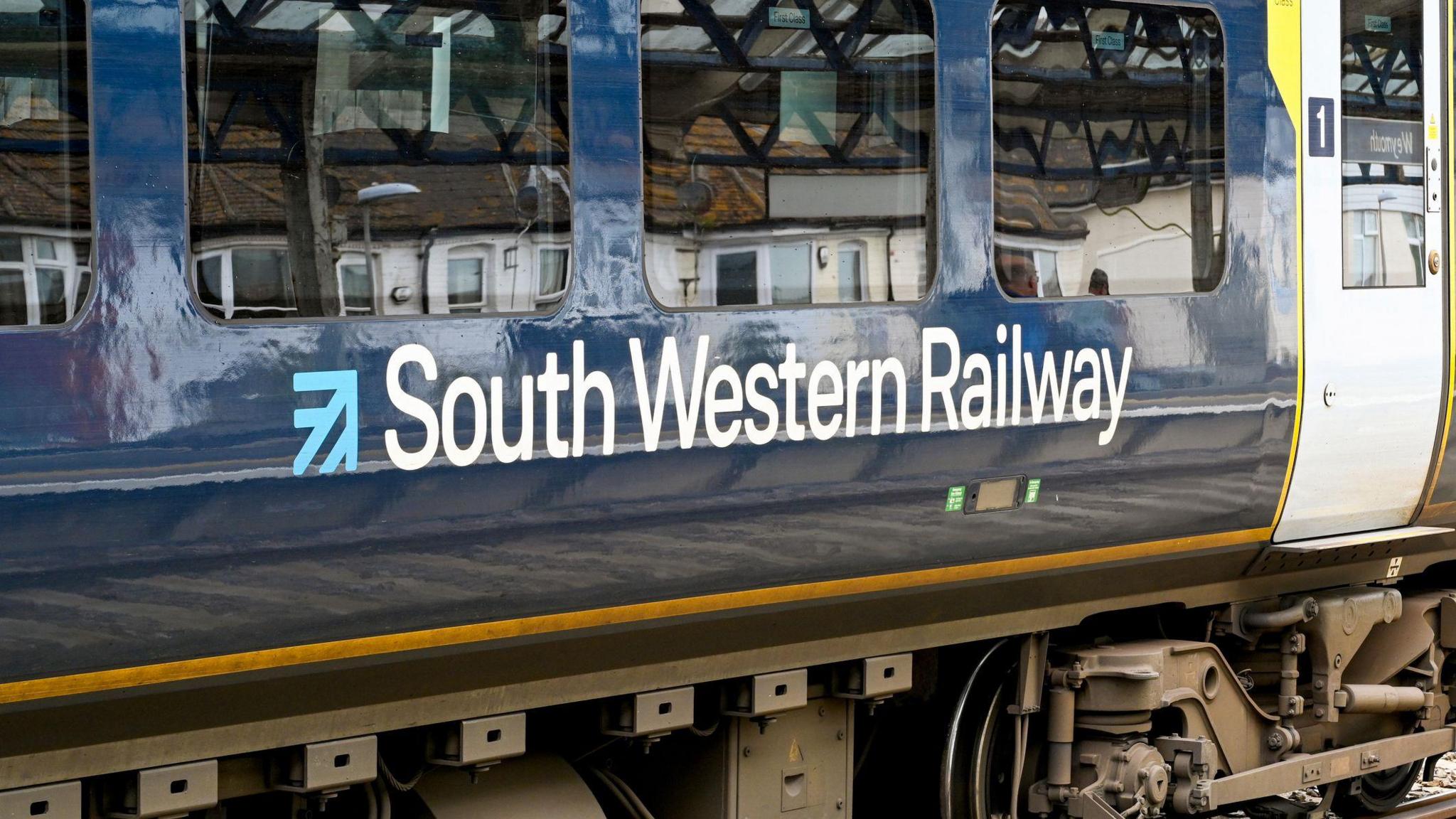 The side view of a carriage on a train operated by South Western Railway.