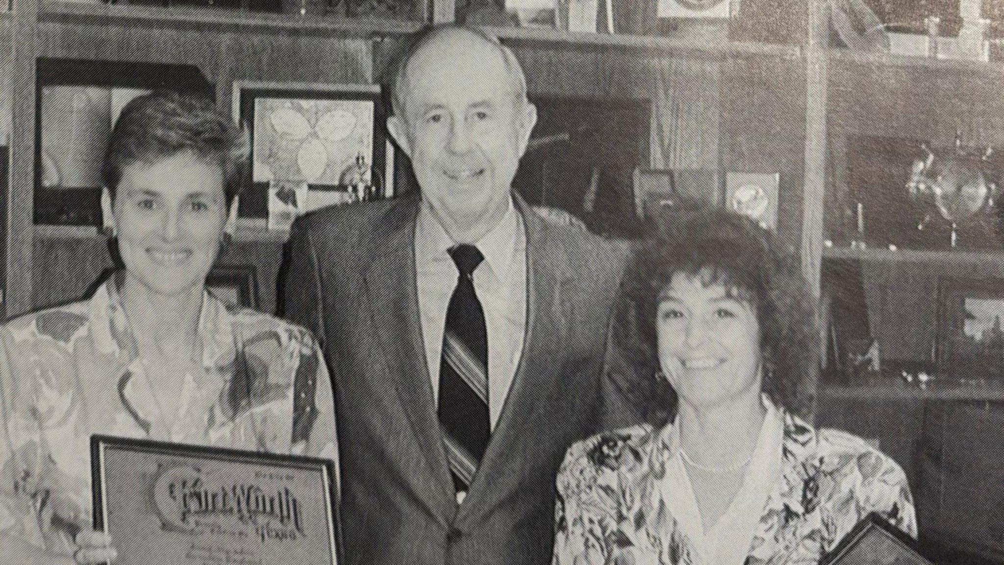 Anna Marsden (left) and Ann Poole (right) and a man staring into the camera. It is a newspaper photo published in 1990.