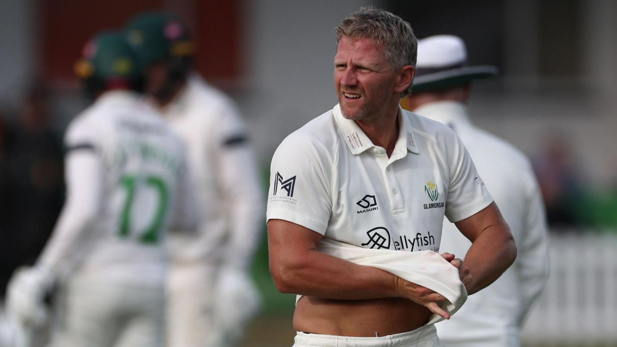 Glamorgan's Timm Van der Gugten gives a rueful sidewards glance as he walks back to his mark against Leicestershire at Grace Road