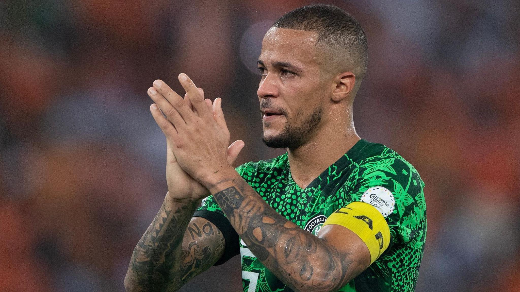 William Troost-Ekong applauds fans following a football game