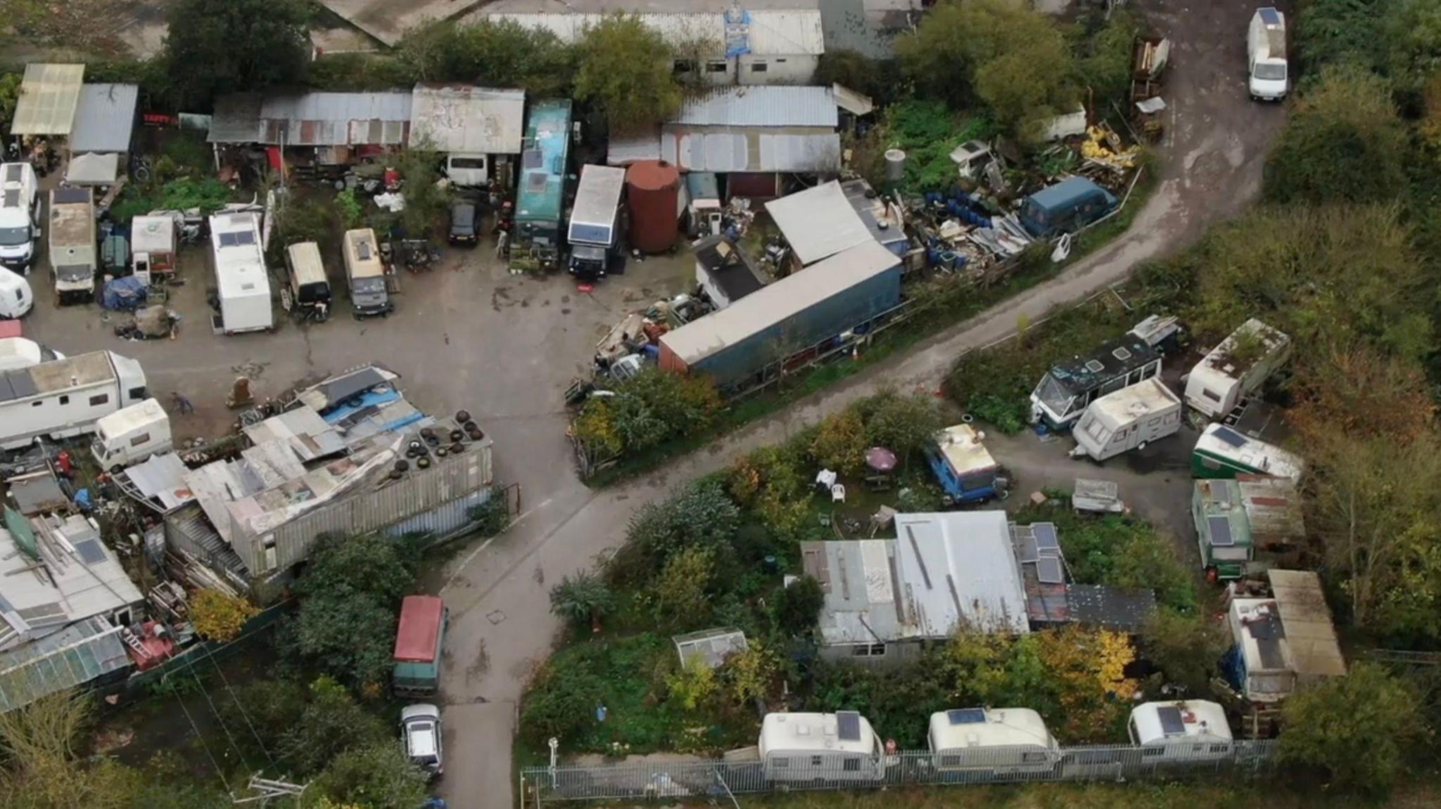 Aerial shots of unkempt caravans at the site in Somerset