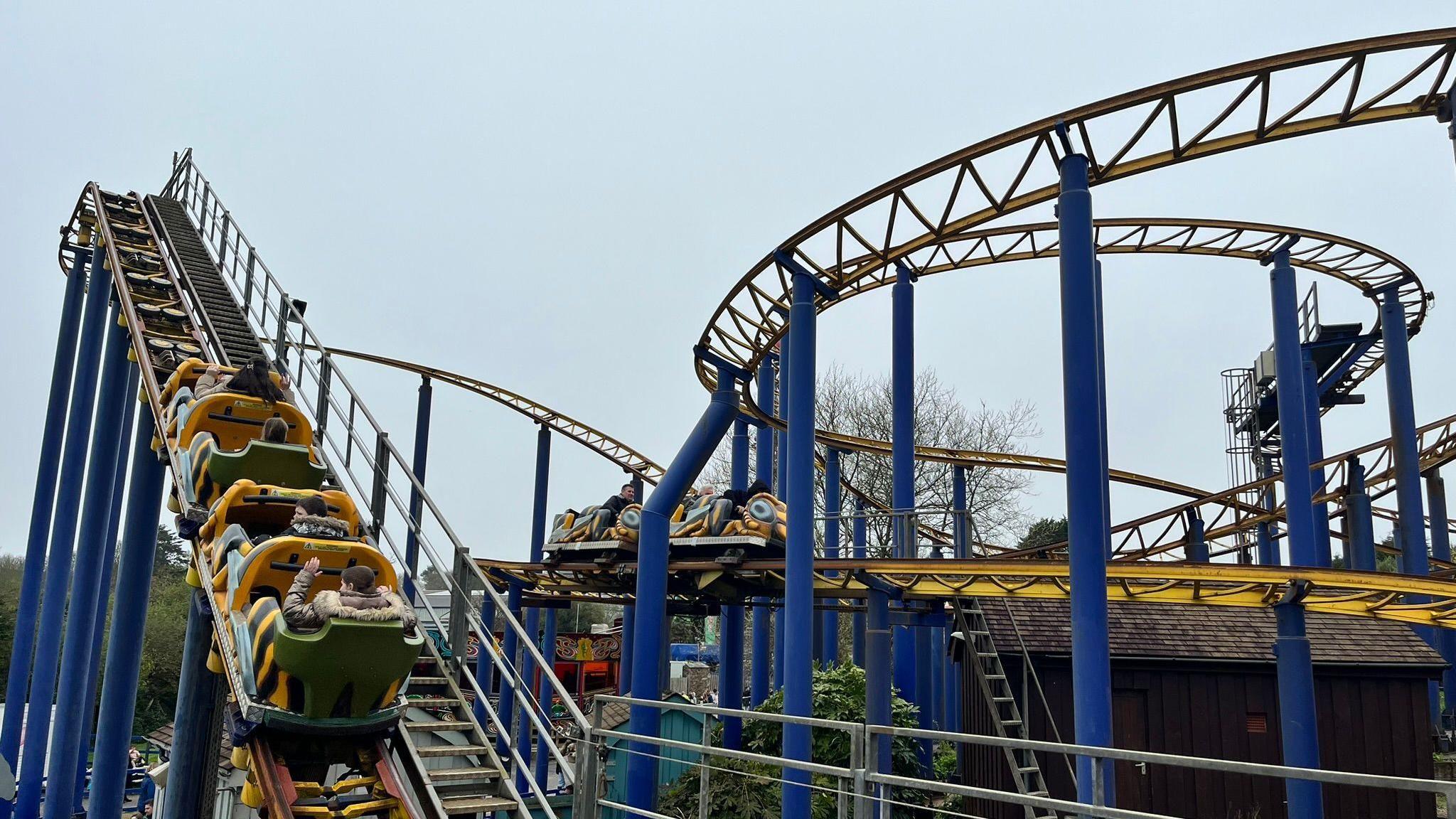 A blue and yellow rollercoaster.