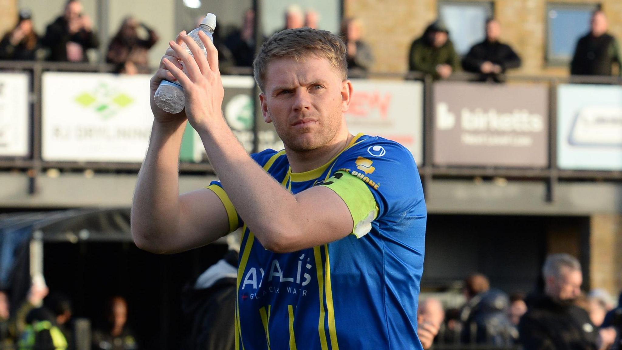 Emlyn Lewis applauds the Weston-super-Mare fans after their 2-0 win against Chelmsford Town the FA Cup second round