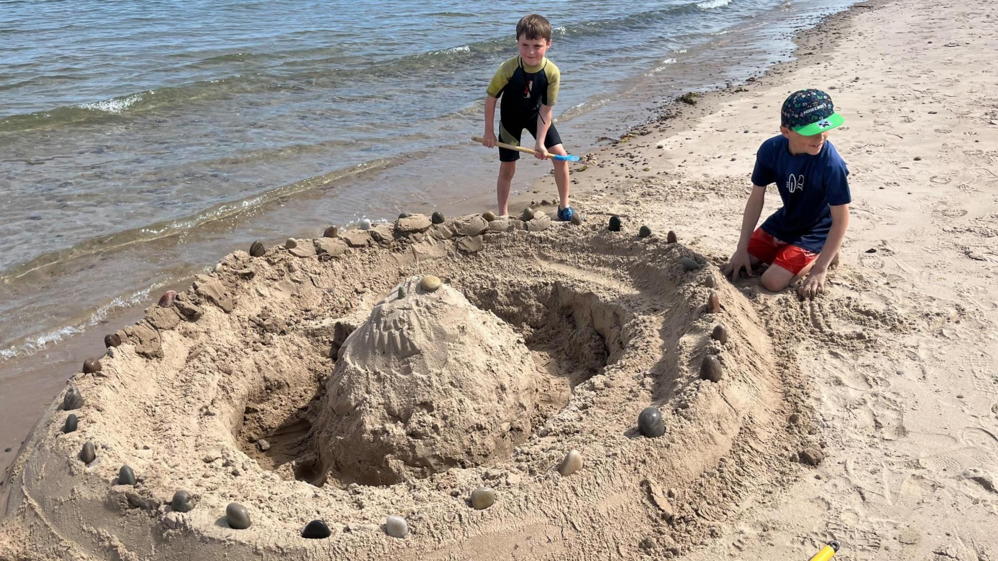 Finn Hume and brother Rohan at Findhorn Beach in Moray