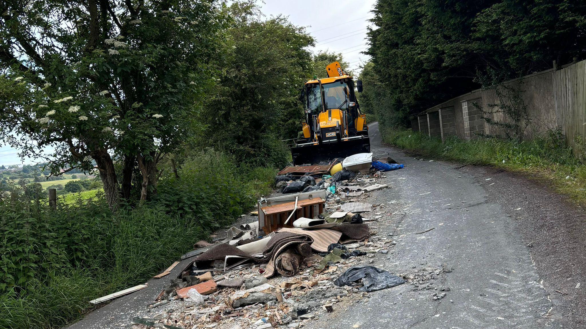 Council clearing waste from road