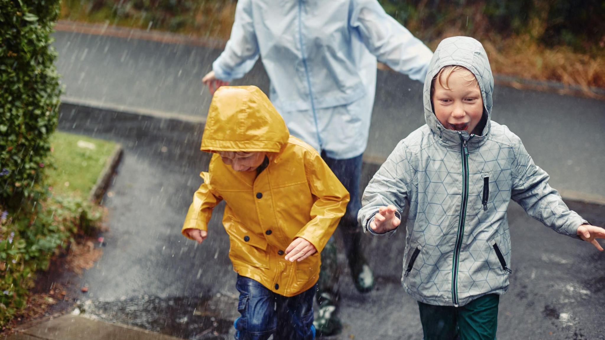 kids running in the rain