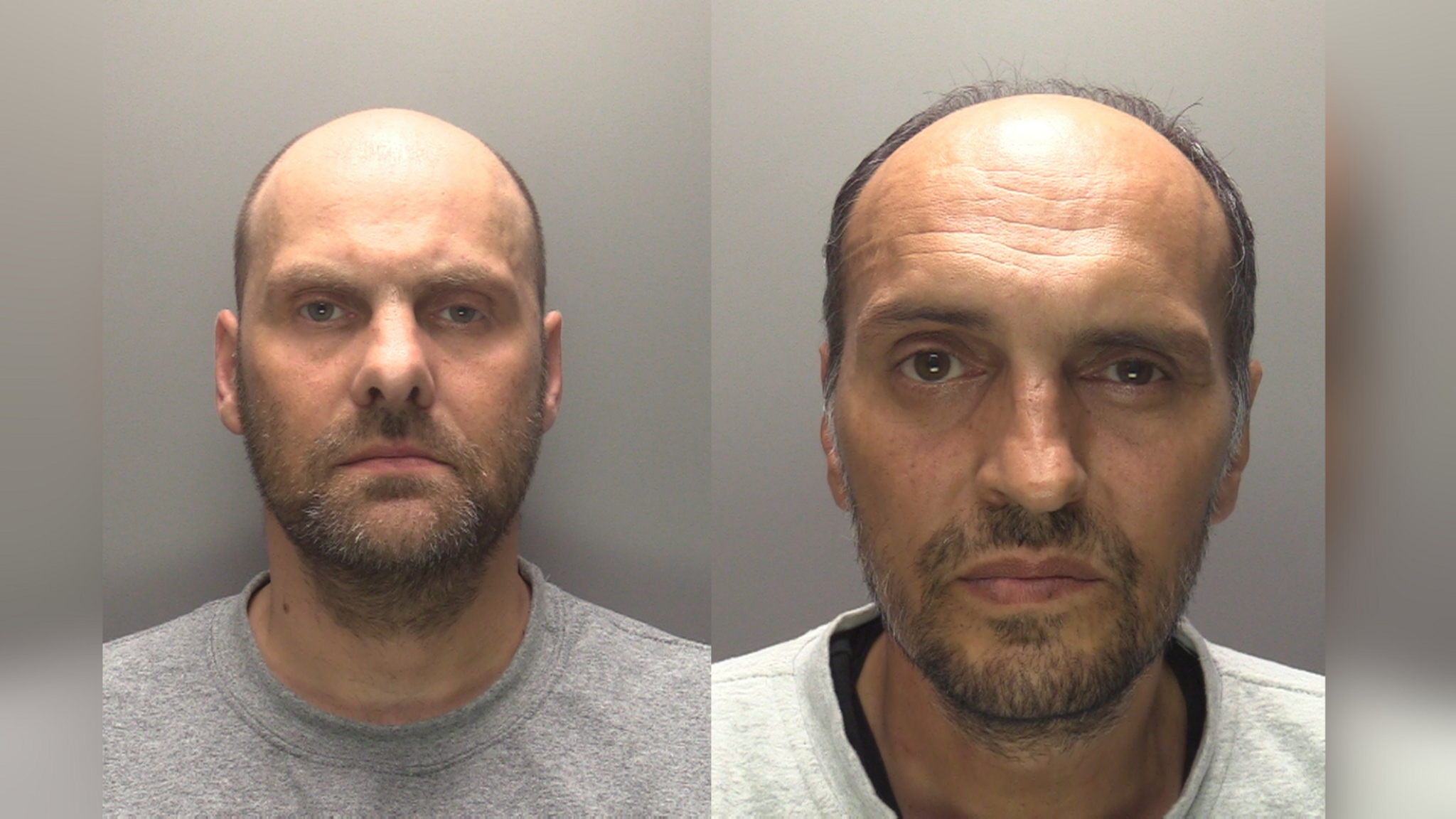 Man with beard and grey top and a man with beard and white top with a dark top underneath.