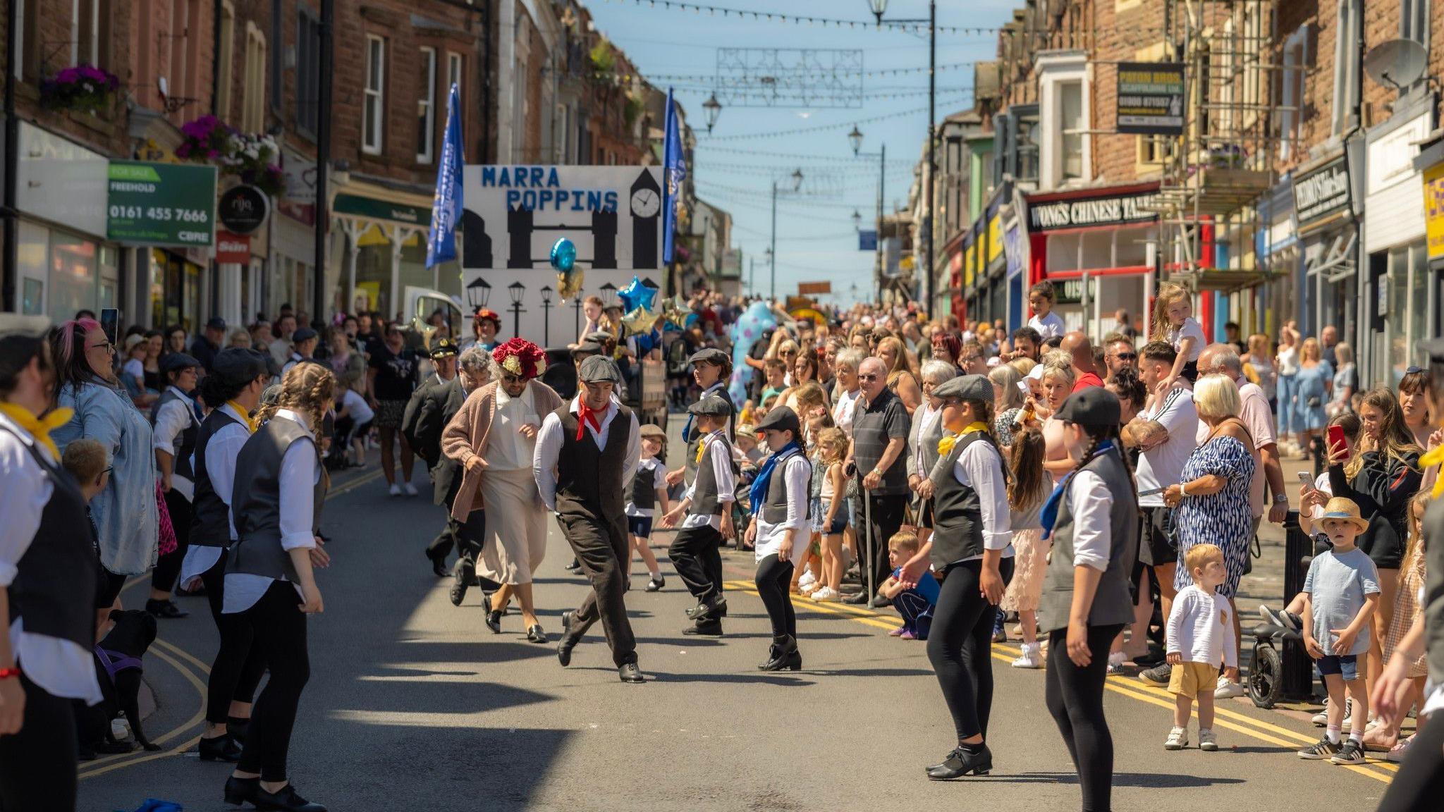 One of the acts performing on Senhouse Street in Maryport for a past carnival