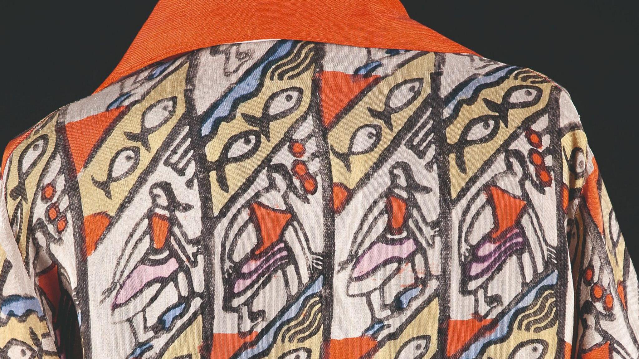 An embroidered and block-printed silk robe by Percy Wyndham Lewis, with a red collar and decorated with images of fish and girls dancing.