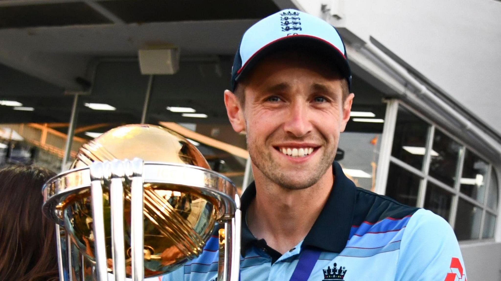 Chris Woakes holding the World Cup