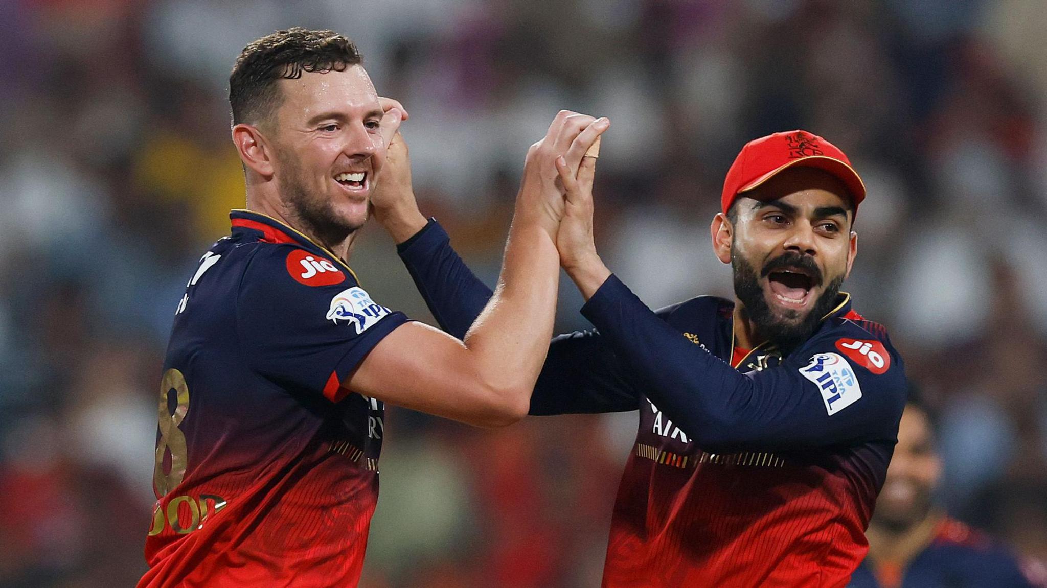 Josh Hazlewood (left) and Virat Kohli (right) of Royal Challengers Bangalore celebrate a wicket
