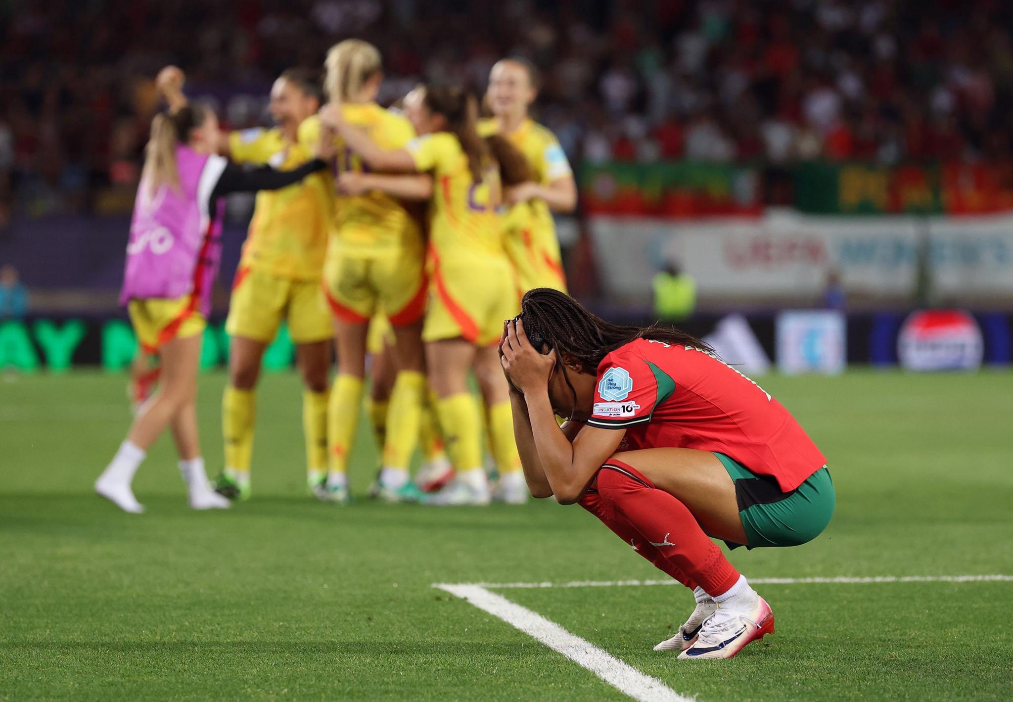 Portugal's Jessica Silva looks dejected at full-time following the team's defeat and subsequent elimination. Photo by Alexander Hassenstein