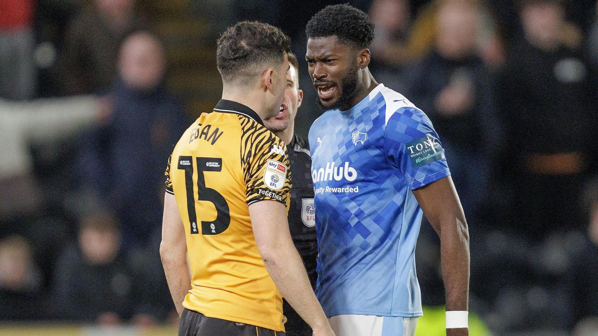 Derby's Patrick Agyemang clashes with Hull defender John Egan