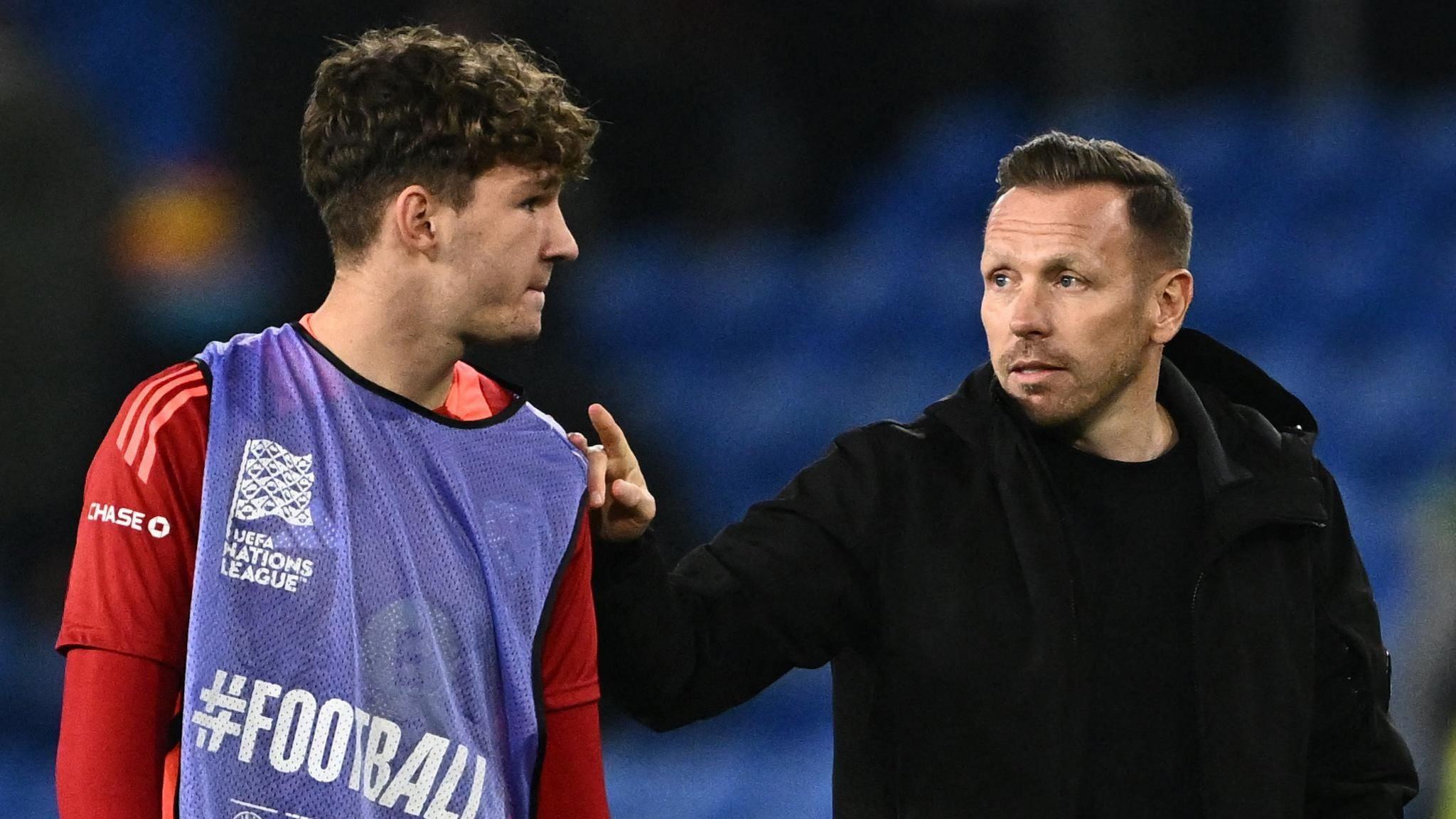 Lewis Koumas with Wales boss Craig Bellamy