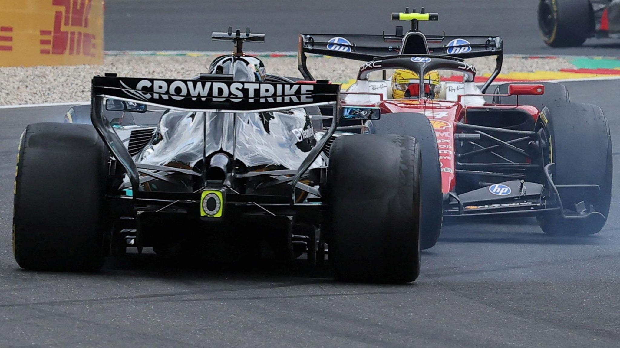 A view of the rear of the Mercedes of George Russell as it spins out of the race, after colliding with Ferrari's Lewis Hamilton on the first lap of the Belgian Grand Prix