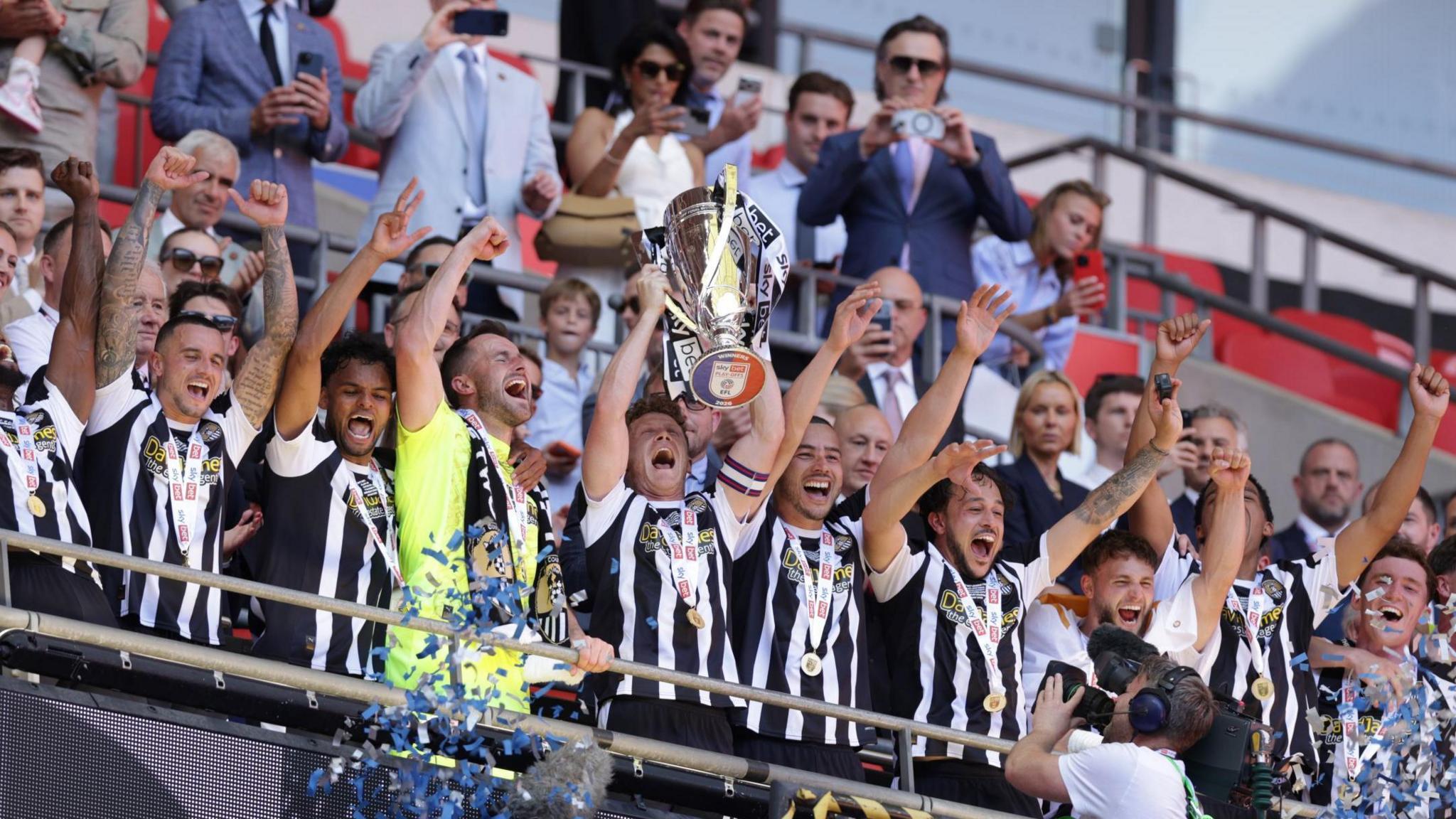 Notts County captain Matt Palmer lifting the League 2 play-off final trophy at Wembley.