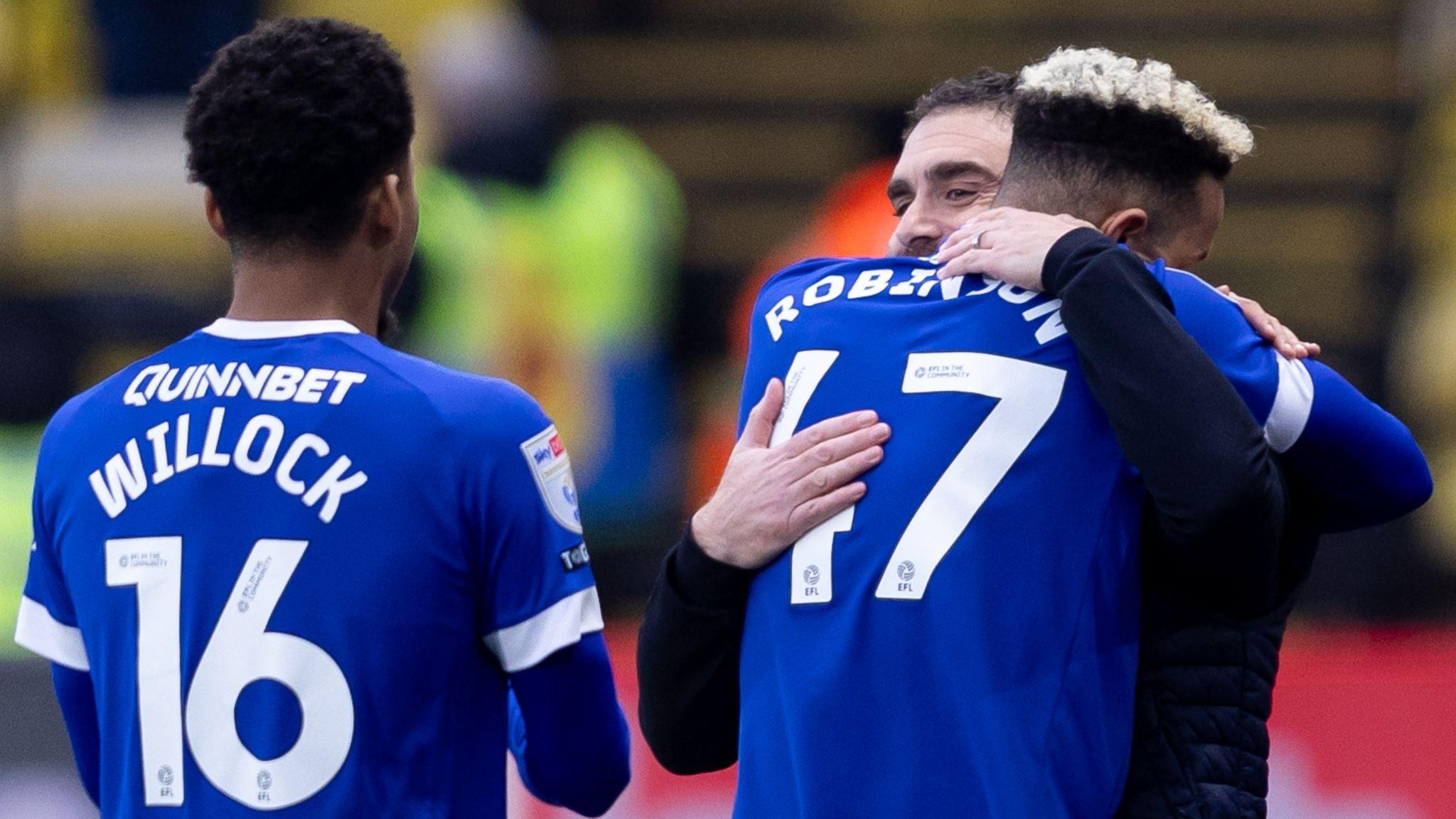 Callum Robinson hugs Omer Riza after putting Cardiff City ahead at Watford.