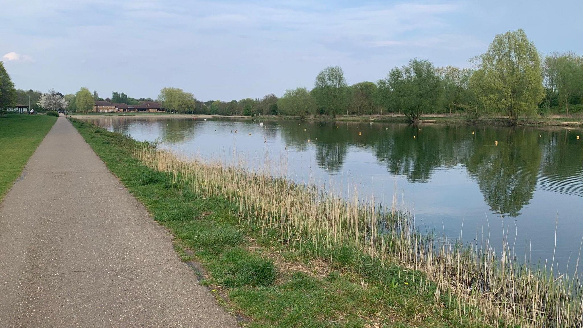 Rowing lake with walking paths on eider side and the hotel in the background.