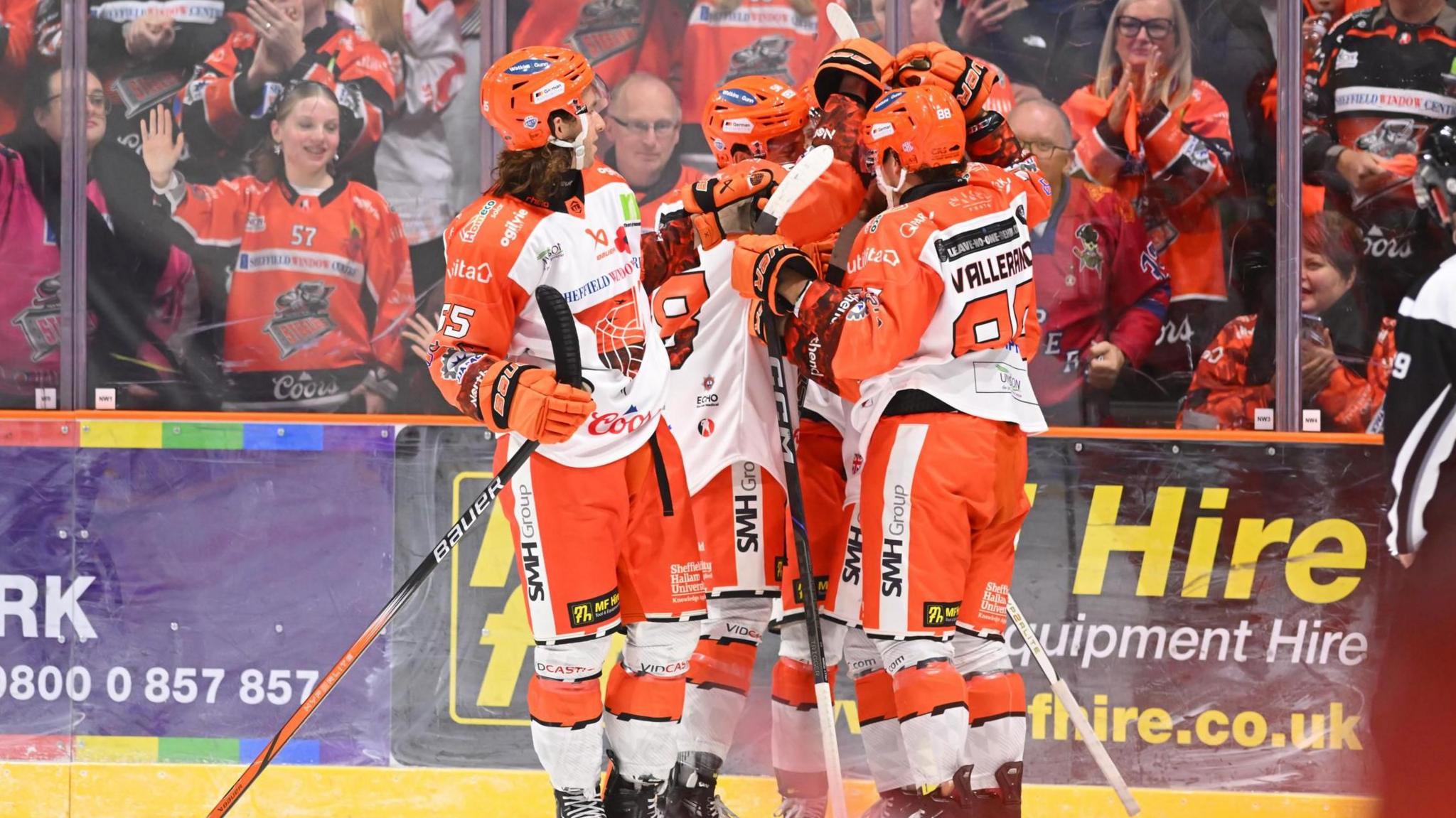 Sheffield Steelers players celebrate in front of the club's fans