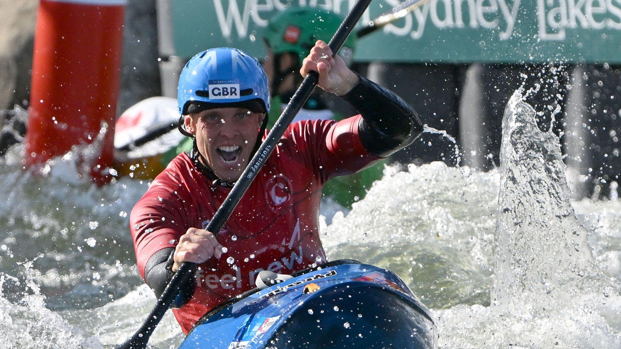 Great Britain's Joe Clarke wins a fourth consecutive kayak cross world title in Sydney, Australia