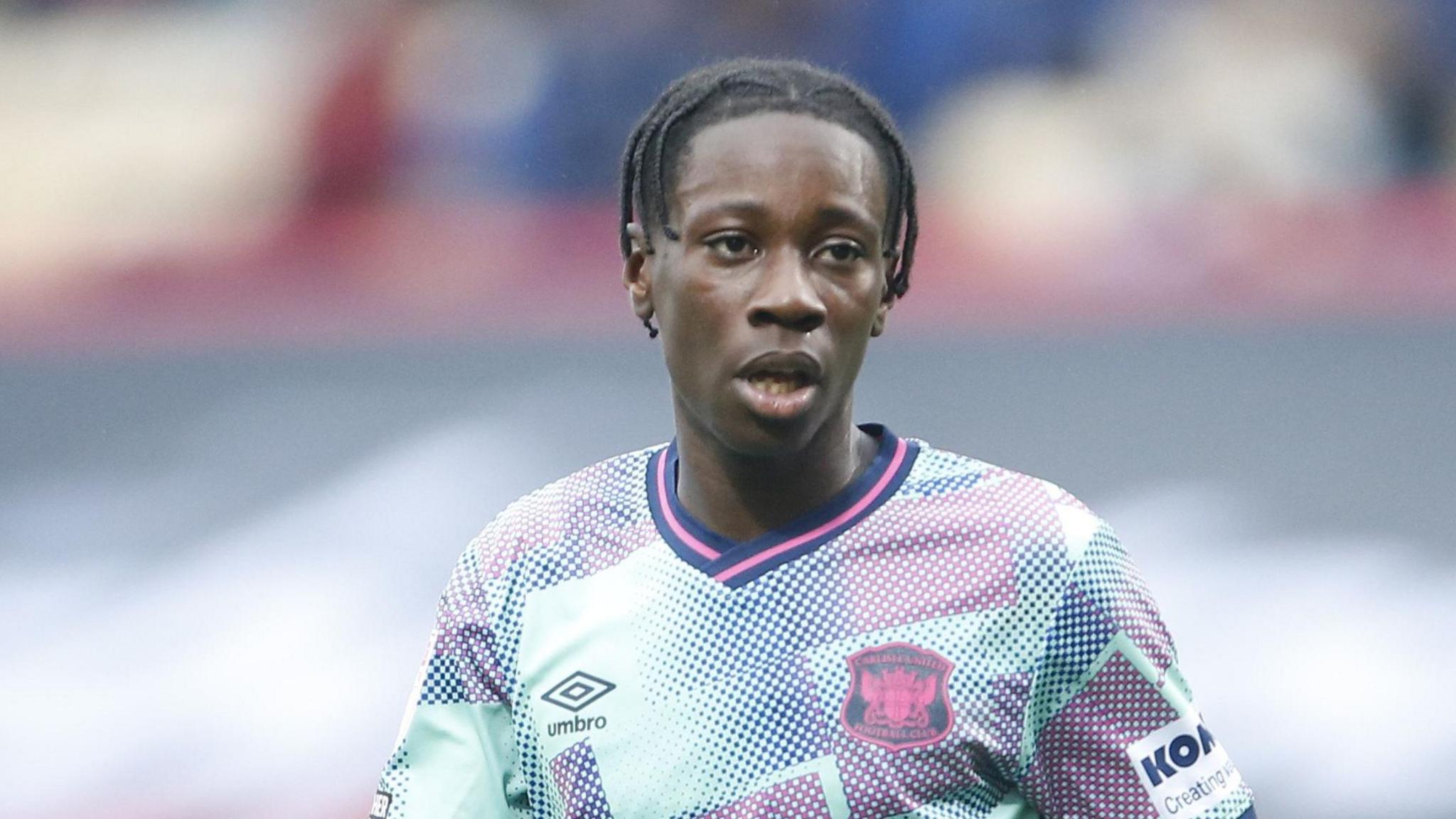 Dominic Sadi playing for Carlisle (wearing their away kit)