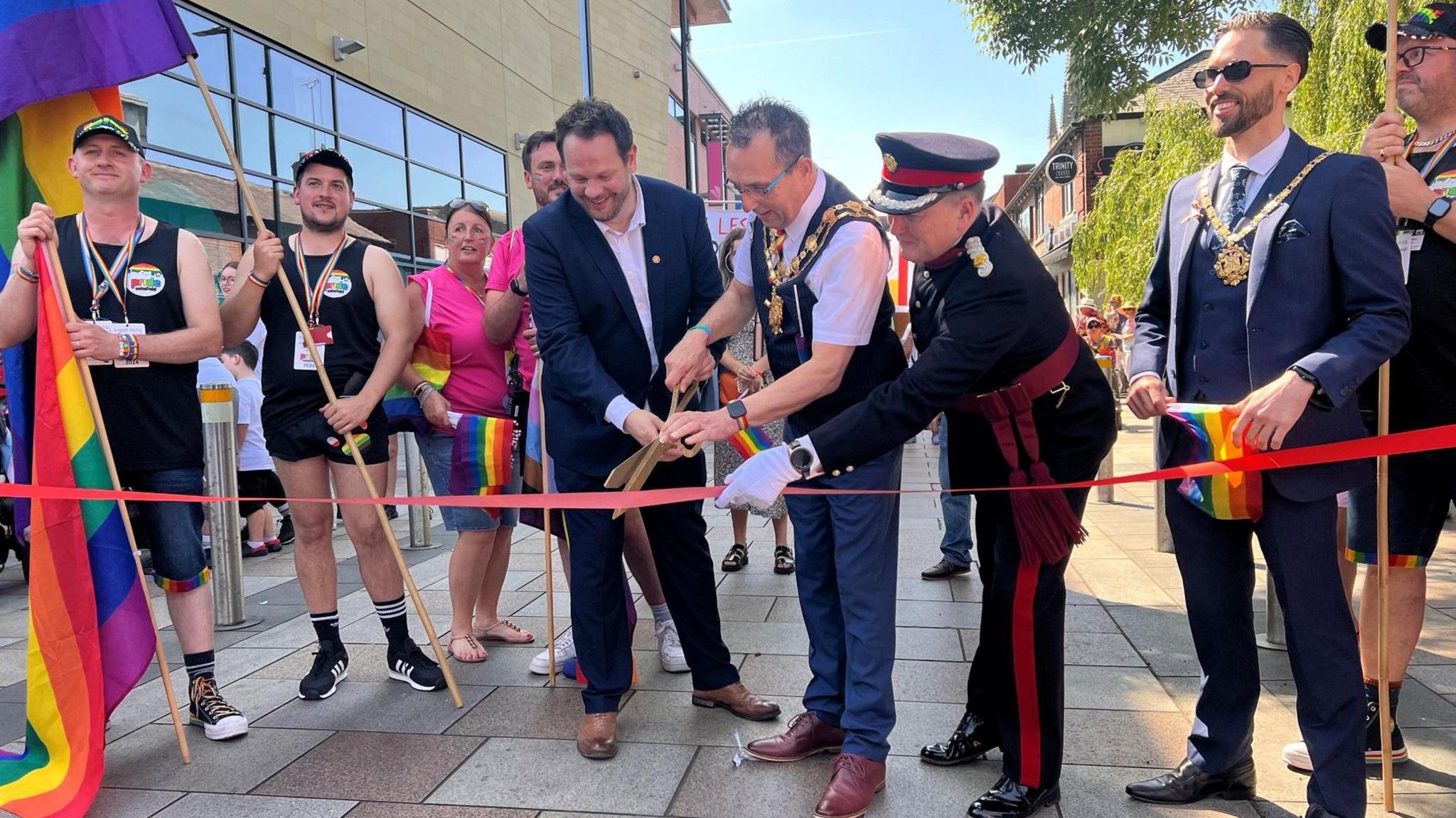 Wakefield MP Simon Lightwood, Mayor Darren Byford and Deputy Lieutenant Jon Hammond cut the ribbon for the 2024 Wakefield Pride parade. 